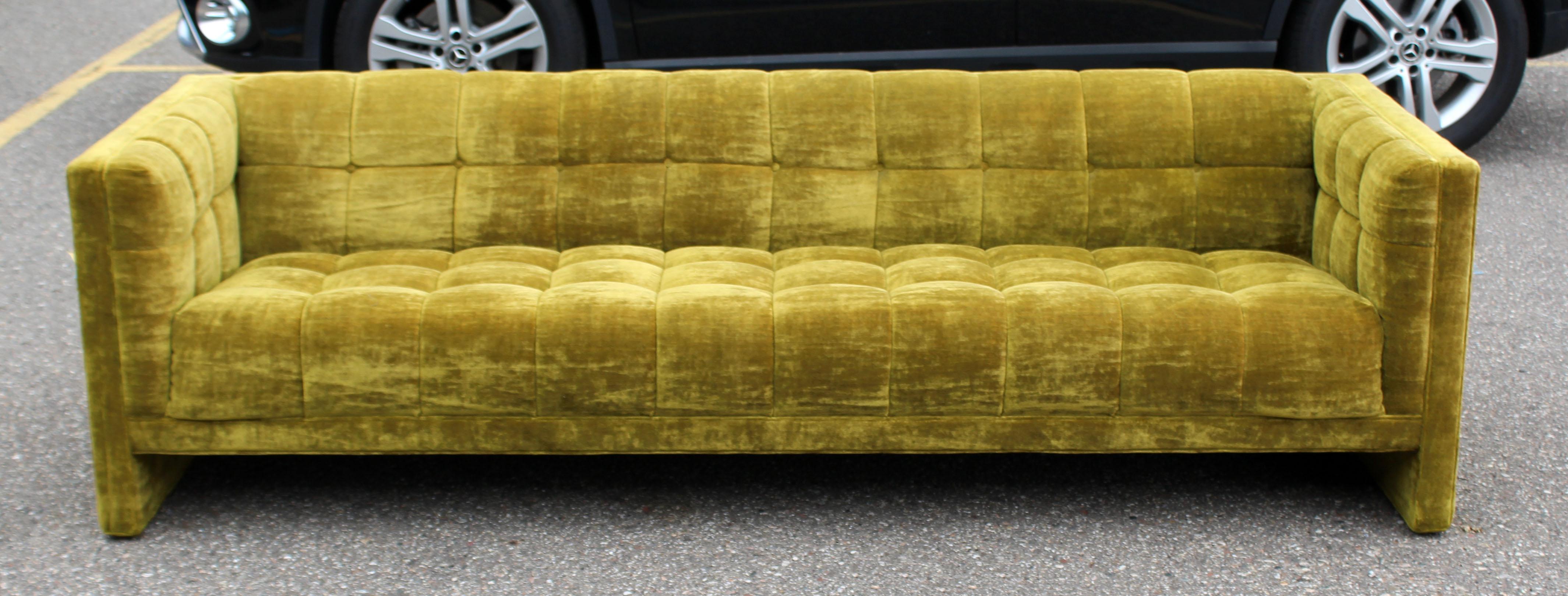 For your consideration is a magnificent, tufted tuxedo avocado green velvet sofa, by Milo Baughman for Englanders, circa1969. Comes with original tags. Fabric is noted as CXhevelle 50. In excellent condition. The dimensions are 89