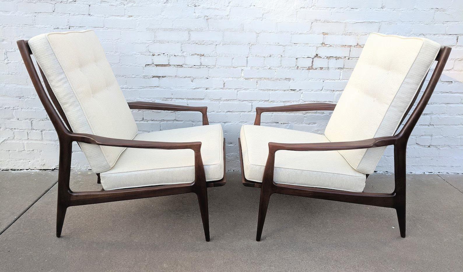 Mid Century Modern Milo Baughman Walnut Lounge Chairs

 In very good vintage condition and structurally sound. They were stripped of a weathered grey oak finish and restained and sprayed with several coats of toner spray finish.

Additional