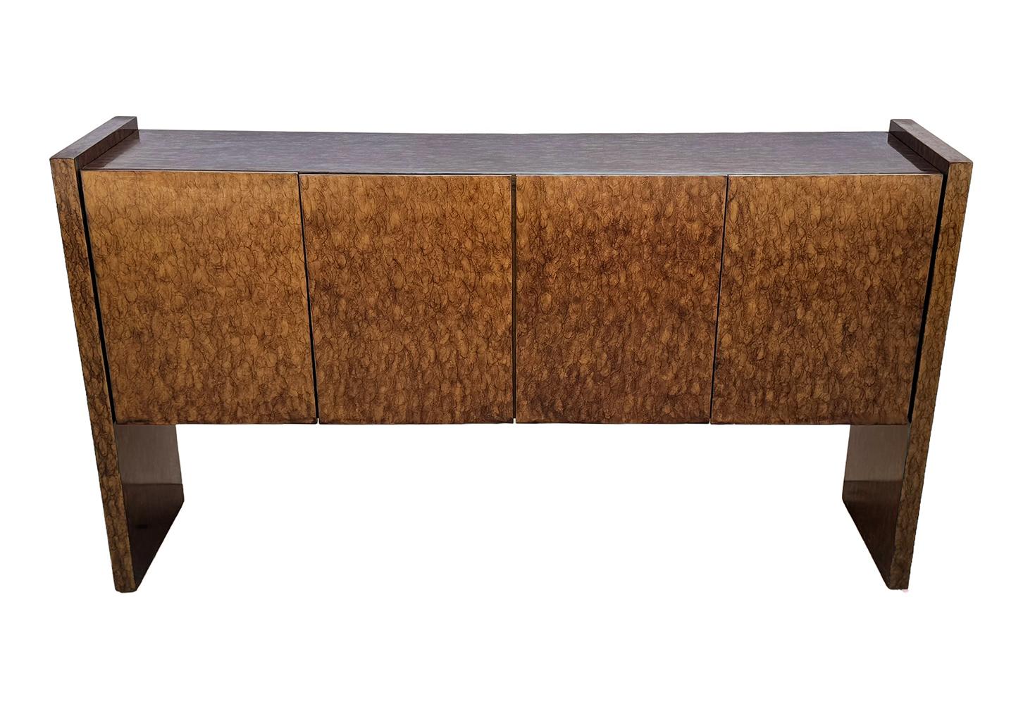 A stately masterpiece designed by Milo Baughman in the 1970s and produced by Thayer Coggin. It features a beautiful faux tortoise shell finish. Interior is chocolate brown. Signed with label in clean original condition. 
