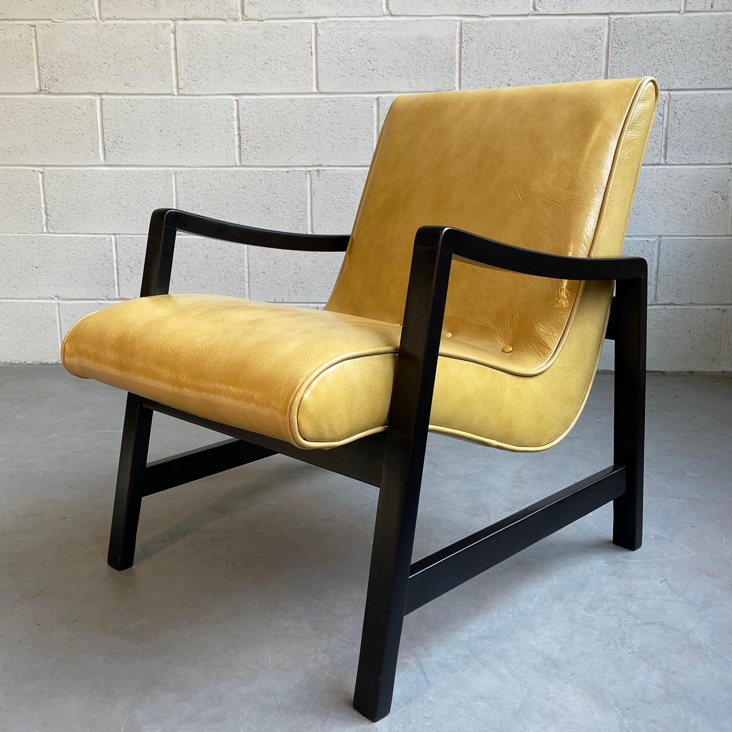 Mid-Century Modern, scoop, lounge chair by Jens Risom for Knoll features a minimal, black lacquered maple frame with a floating scoop seat newly upholstered in mustard yellow, textured leather.