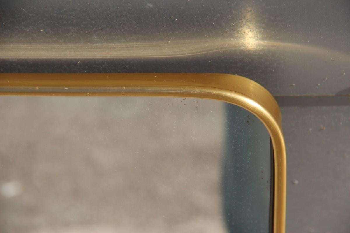 Mid-Century Modern mirror aluminium golden Italian design minimal shape,
lower width cm 38.
