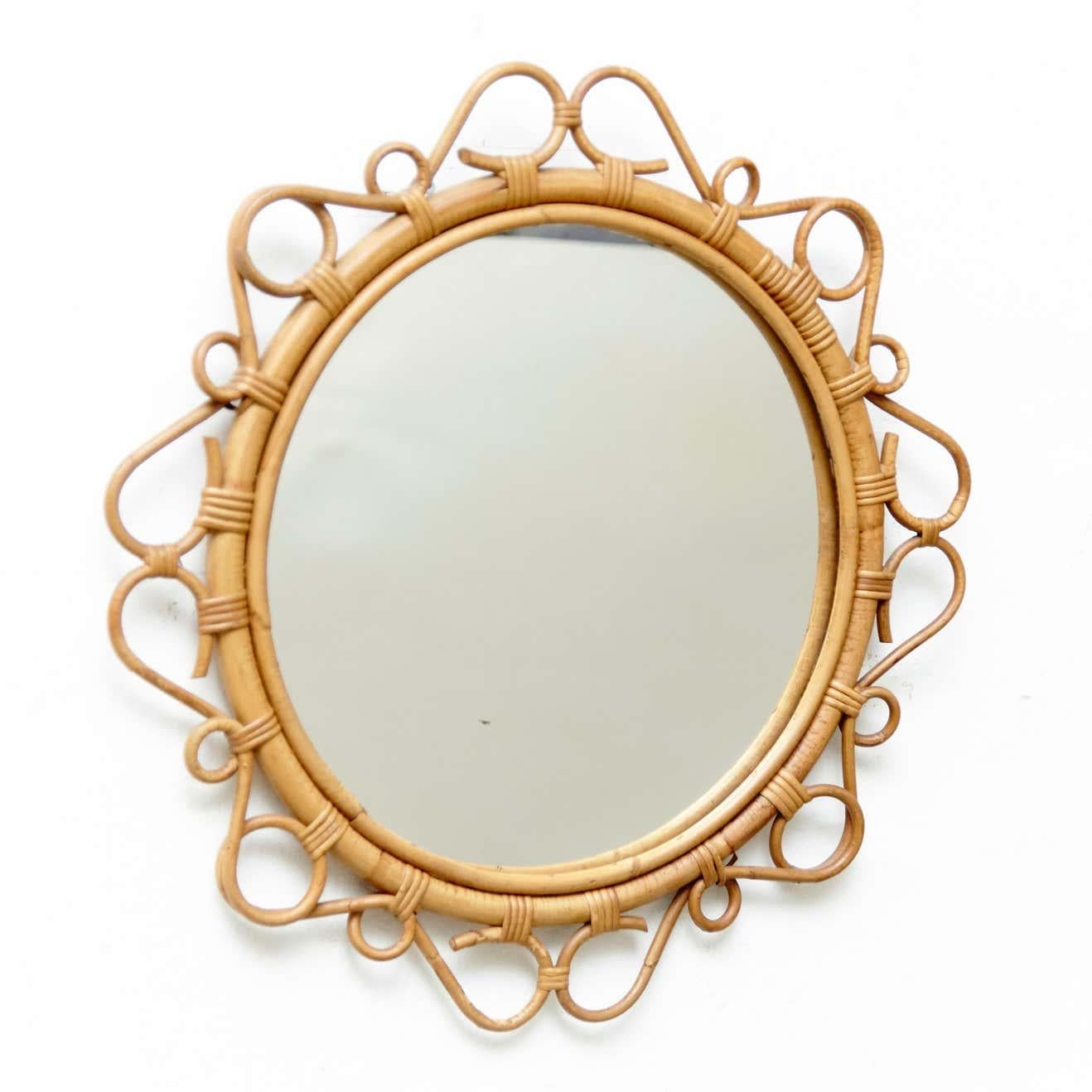 ntroduce vintage coastal charm to your home with this Mid-Century Modern mirror, expertly handcrafted from bamboo and rattan. Dating back to circa 1960, this mirror was traditionally manufactured in the French Riviera.

The intricate design of this