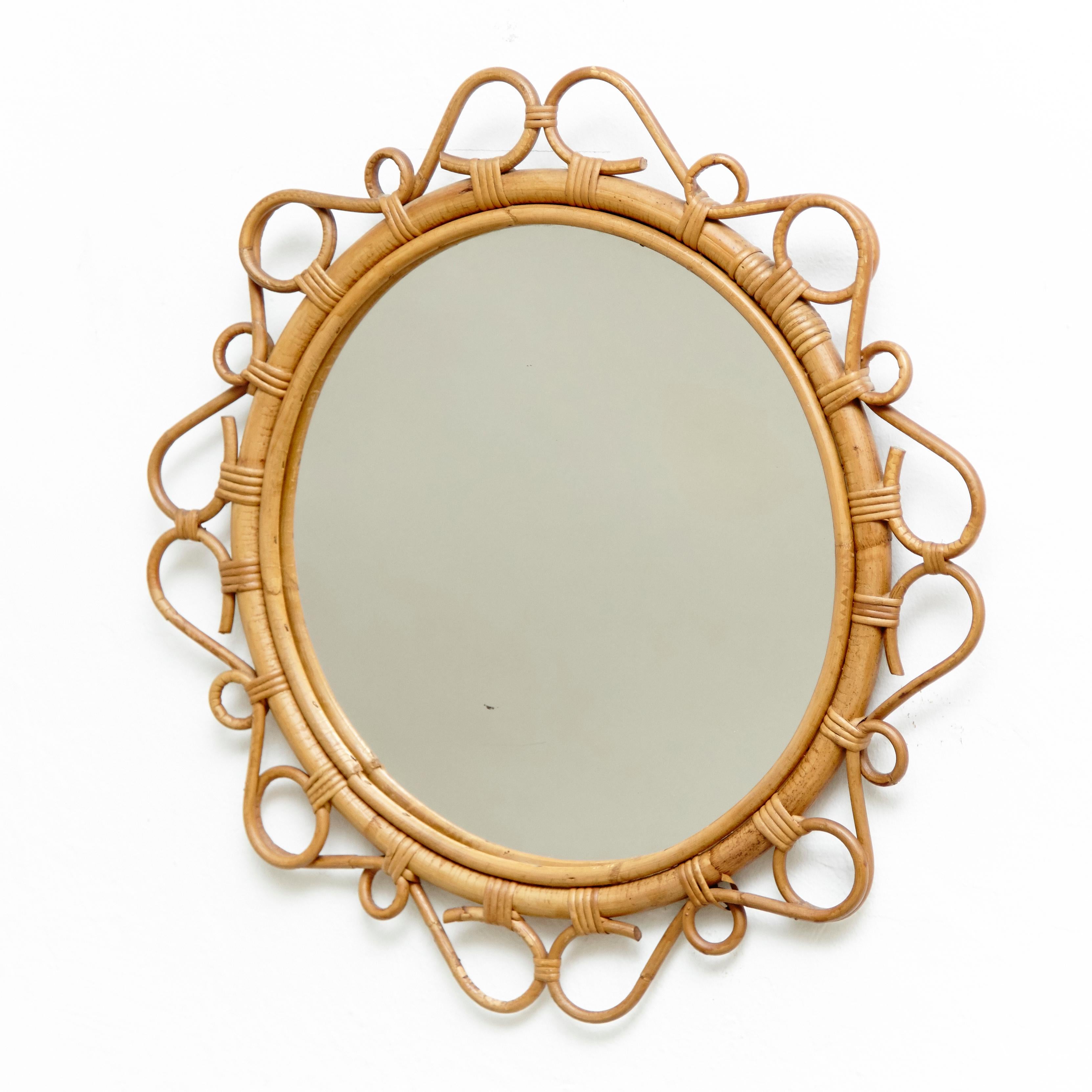 Mid-Century Modern mirror bamboo and rattan handcrafted, circa 1960
Traditionally manufactured in French.
By unknown designer.

In original condition with minor wear consistent of age and use, preserving a beautiful patina.

