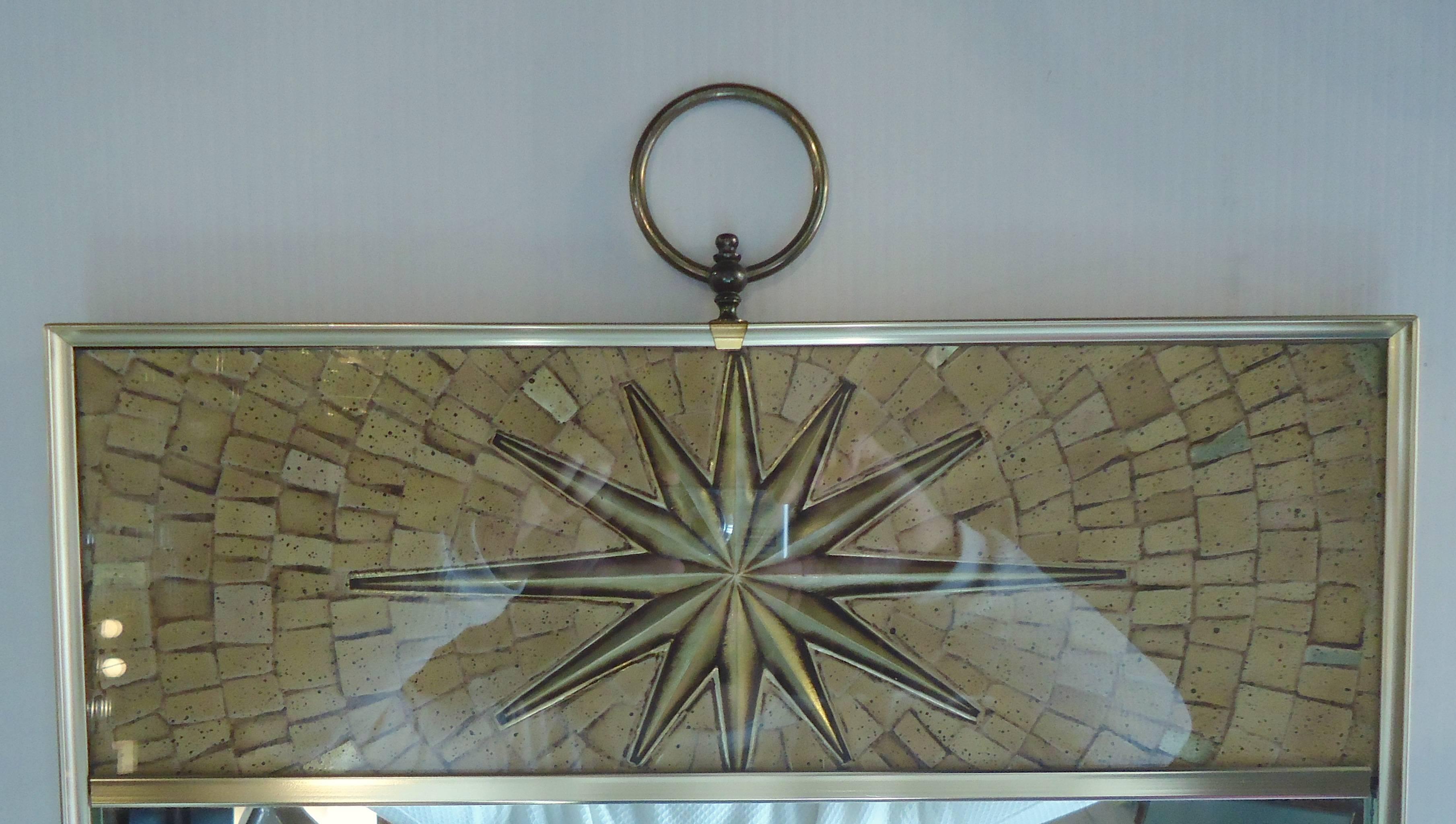 Unique hanging mirror with a tessellated style top with sunburst brass, matching the frame.

(Please confirm item location - NY or NJ - with dealer).
 
