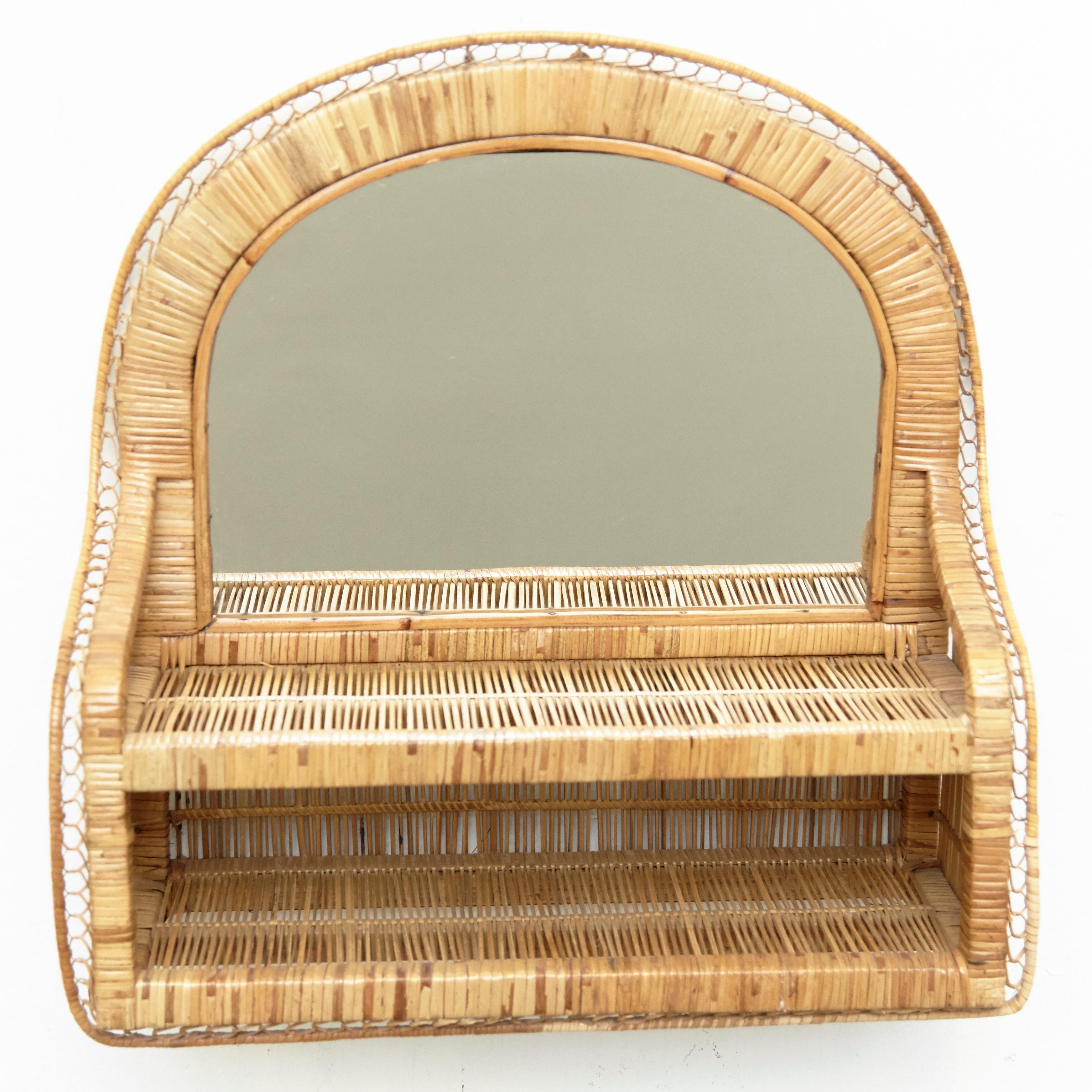 Mid-Century Modern mirror rattan handcrafted, circa 1960
Traditionally manufactured in France.
By unknown designer.

In original condition with minor wear consistent of age and use, preserving a beautiful patina.

 