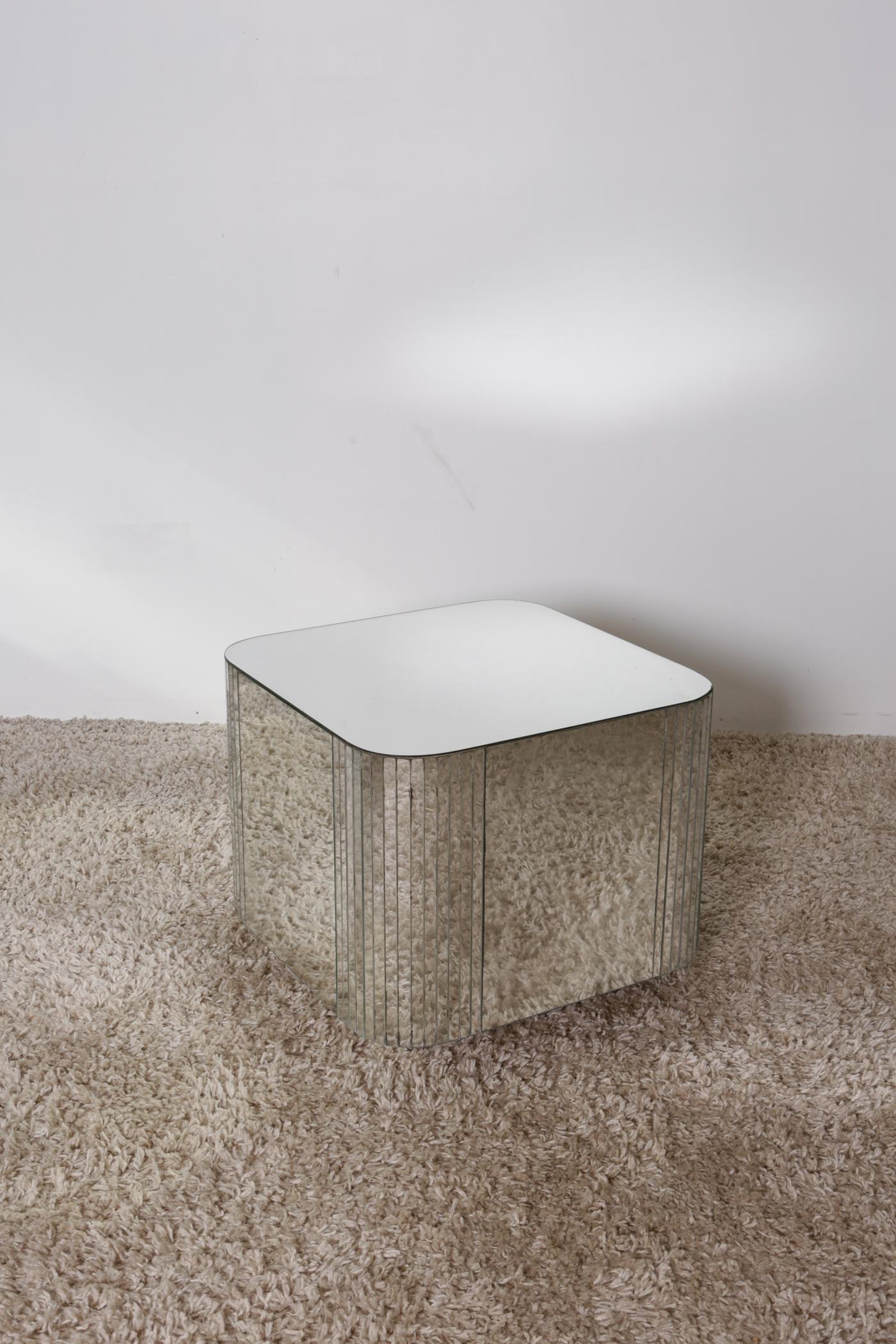 Mid-Century Modern mirror coffee/side table. A versatile, fun mirror cube table that can be used for either a side or coffee table. With the beautiful Mid-Century Modern mirror detail, this table compliments any interior. A minor chip in the bottom