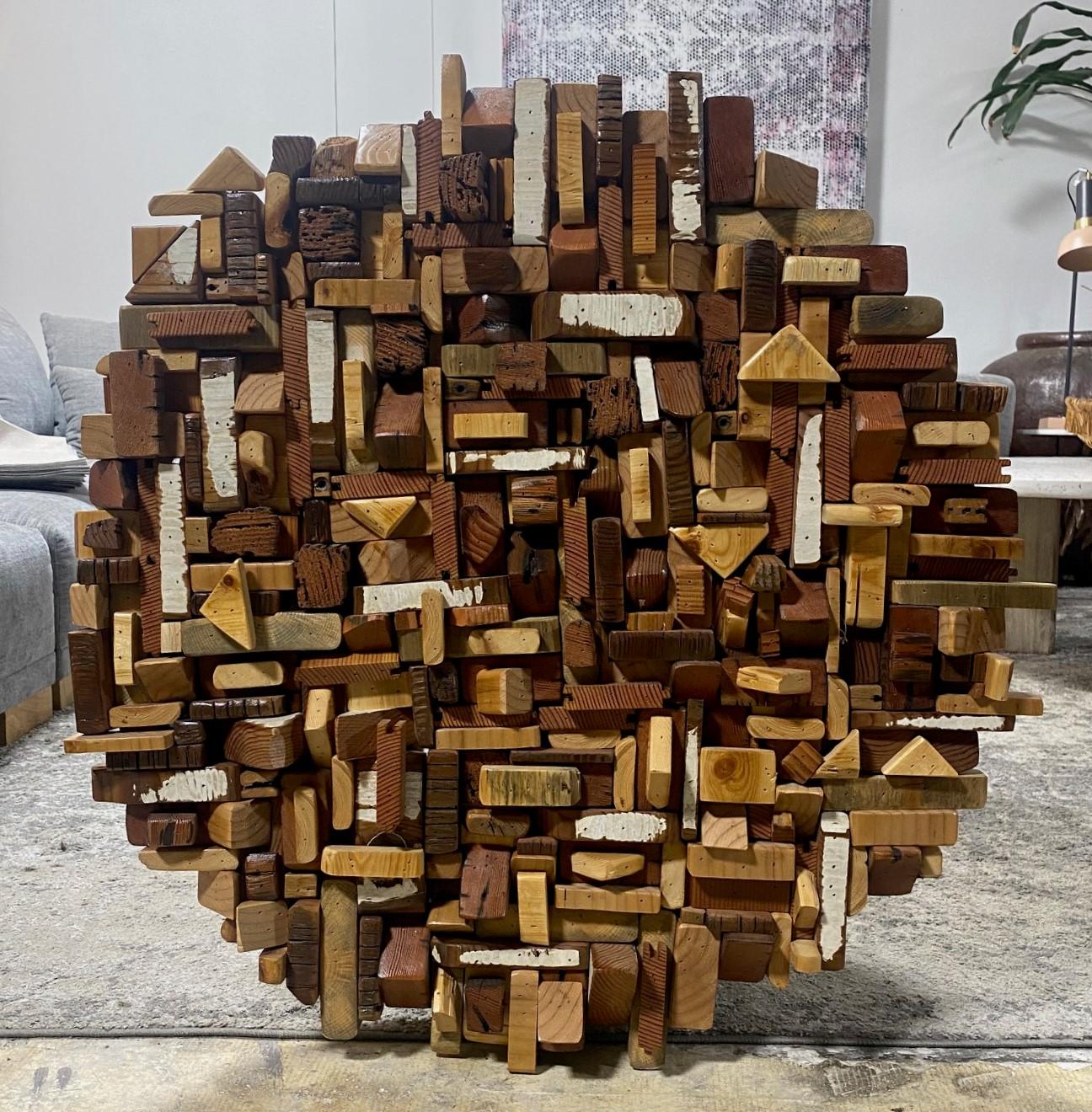 A wonderful, unique, and rather special large round Mid-Century Modern/ Modernist wall sculpture made of various mixed shapes of natural/organic pieces of wood.  

There are rings for hanging affixed to the verso.  

Truly a fantastic piece.  Quite
