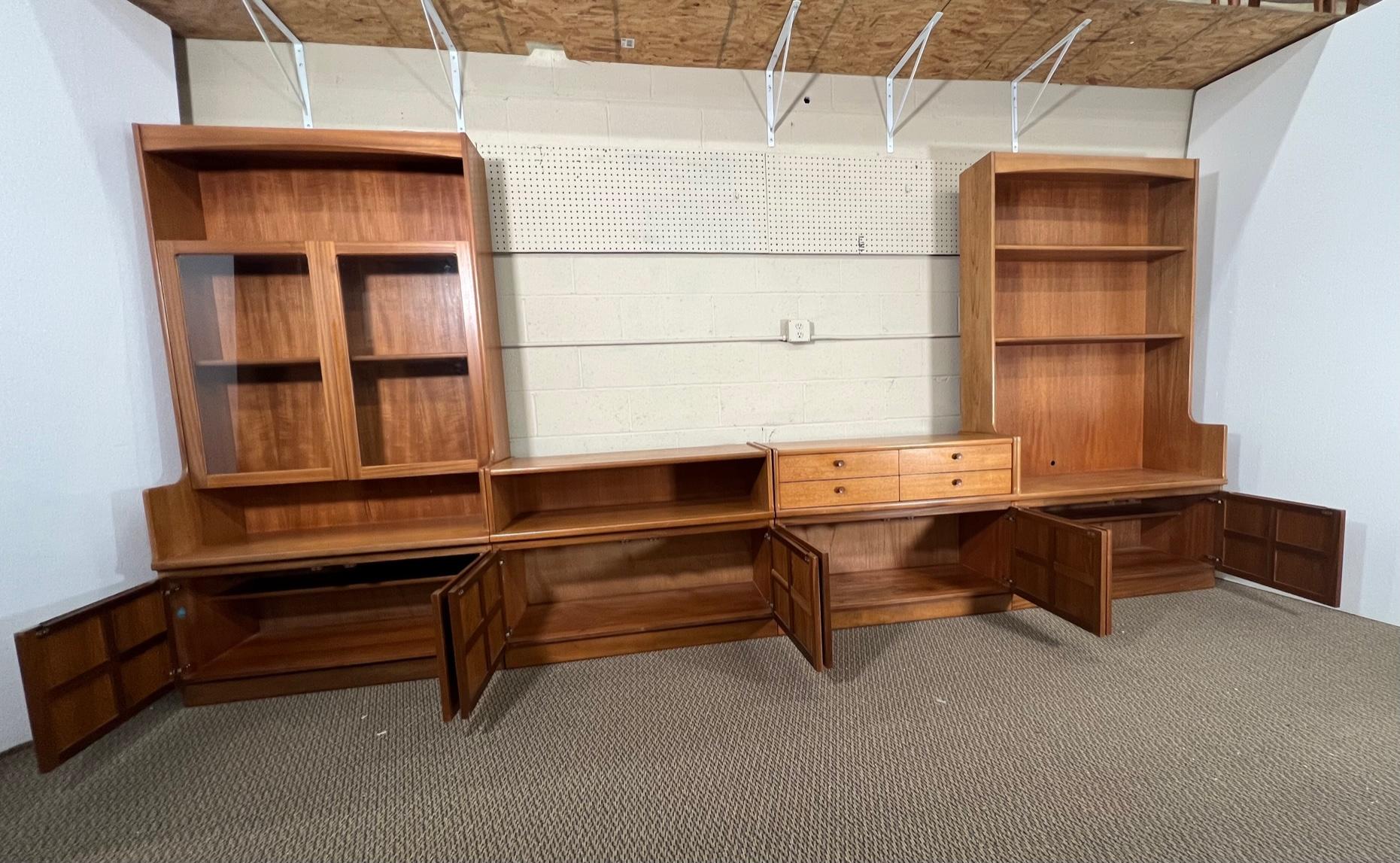 Fantastic teak wall unit made by Nathan Furniture. Made in England.

Can be arranged in multiple ways. Picture shows just one way to set it up. It can also be combined with other Nathan wall units. Original labels are attached.

Very good vintage