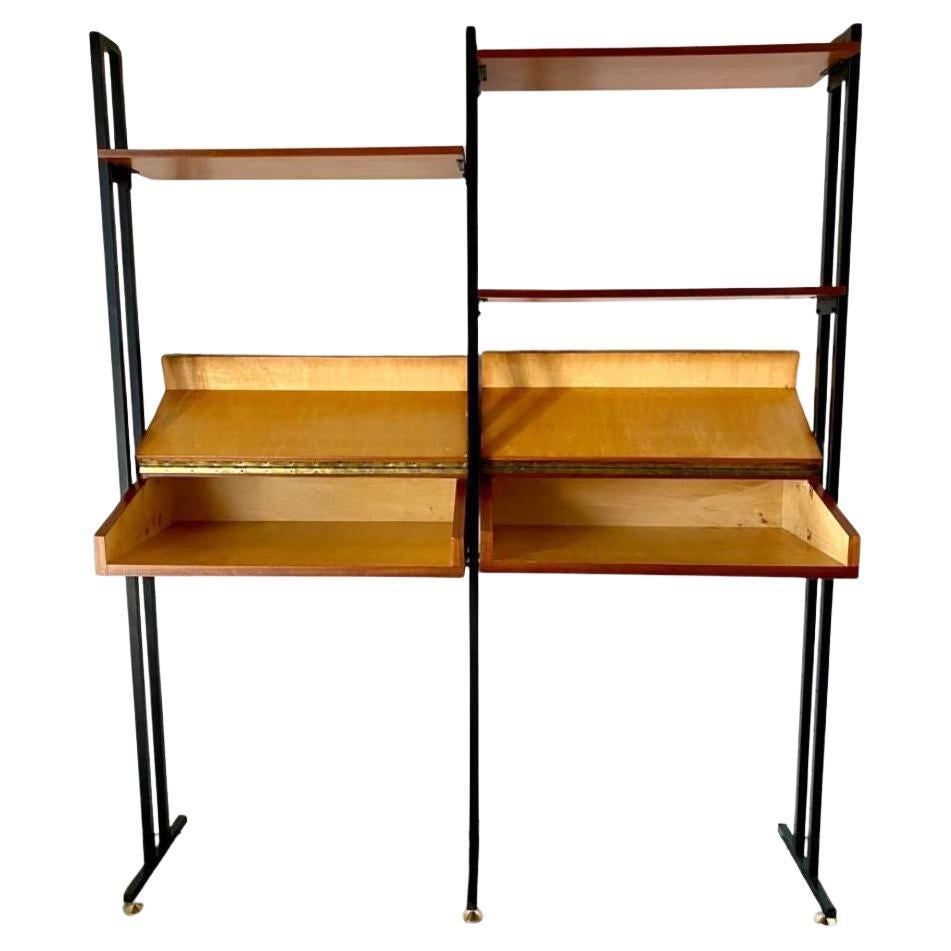 Mid-Century Modern Modular Teak Bookshelf, Italy 1960s

An unsual modular bookshelf crafted in Italy in the 1960s, featuring a sleek iron frame with polished brass feet, two uniquely designed reclyning wood drawers, and three adjustable teak shelves
