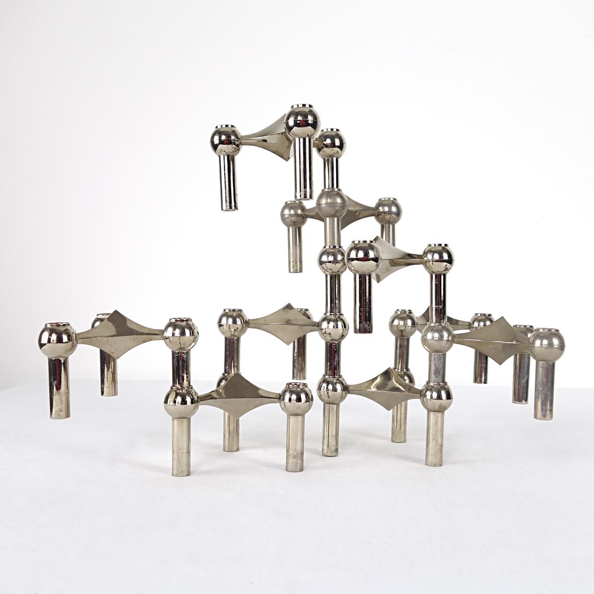 Set of 9 modular triangle shaped chrome candleholders produced by BMF in the 1960s. The candleholders can be stacked in any design you desire.