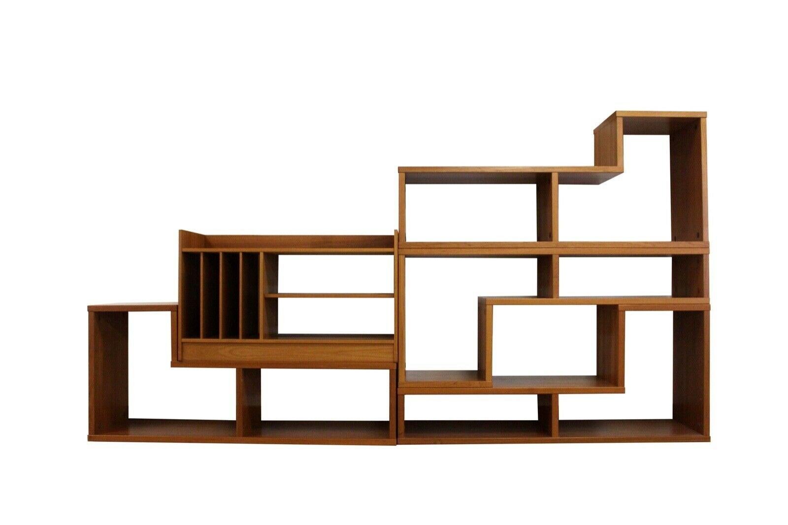 Five teak veneered shelving units come together to create this amazing and versatile modular wall unit allowing it to hold numerous display and storage items. Arrange and rearrange to your liking depending on your room size and space as the warm