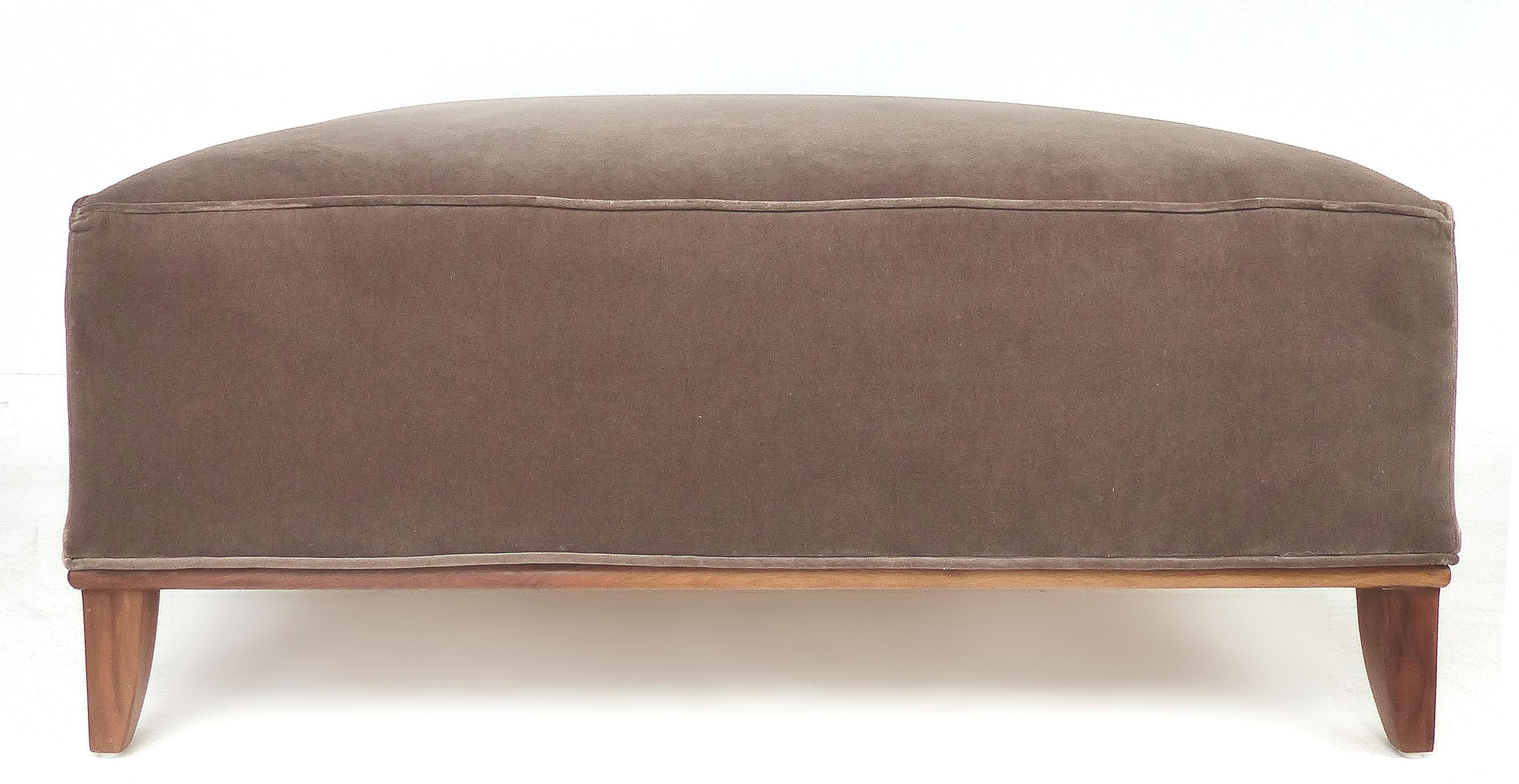 Square midcentury mohair upholstered ottoman with wood base

Offered for sale is a Mid-Century Modern square ottoman that is upholstered in mohair velvet. The ottoman is supported by a wood frame with gracefully tapered legs.