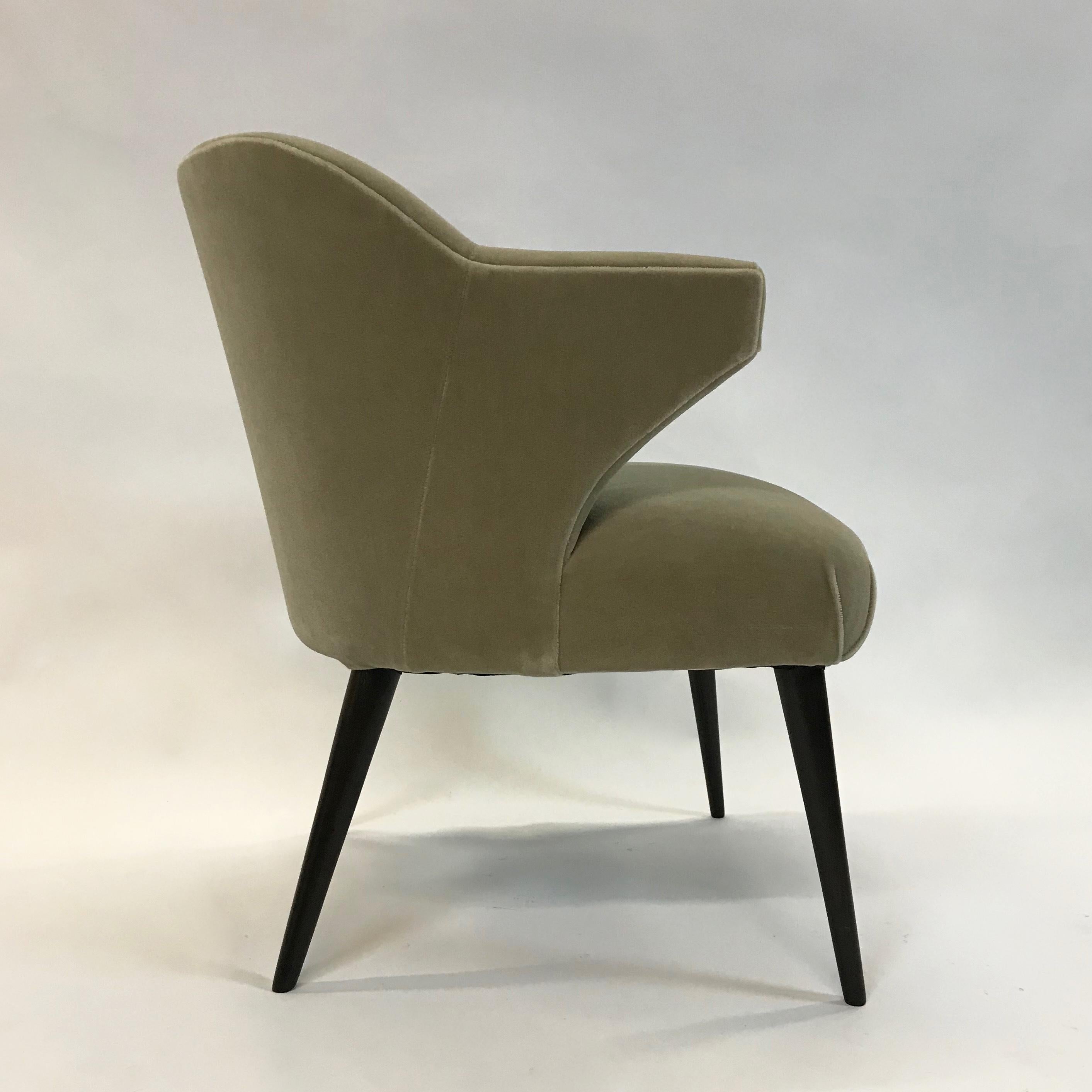 Stylish. Mid-Century Modern, wing arm, armchair is newly upholstered in a muted moss green mohair.