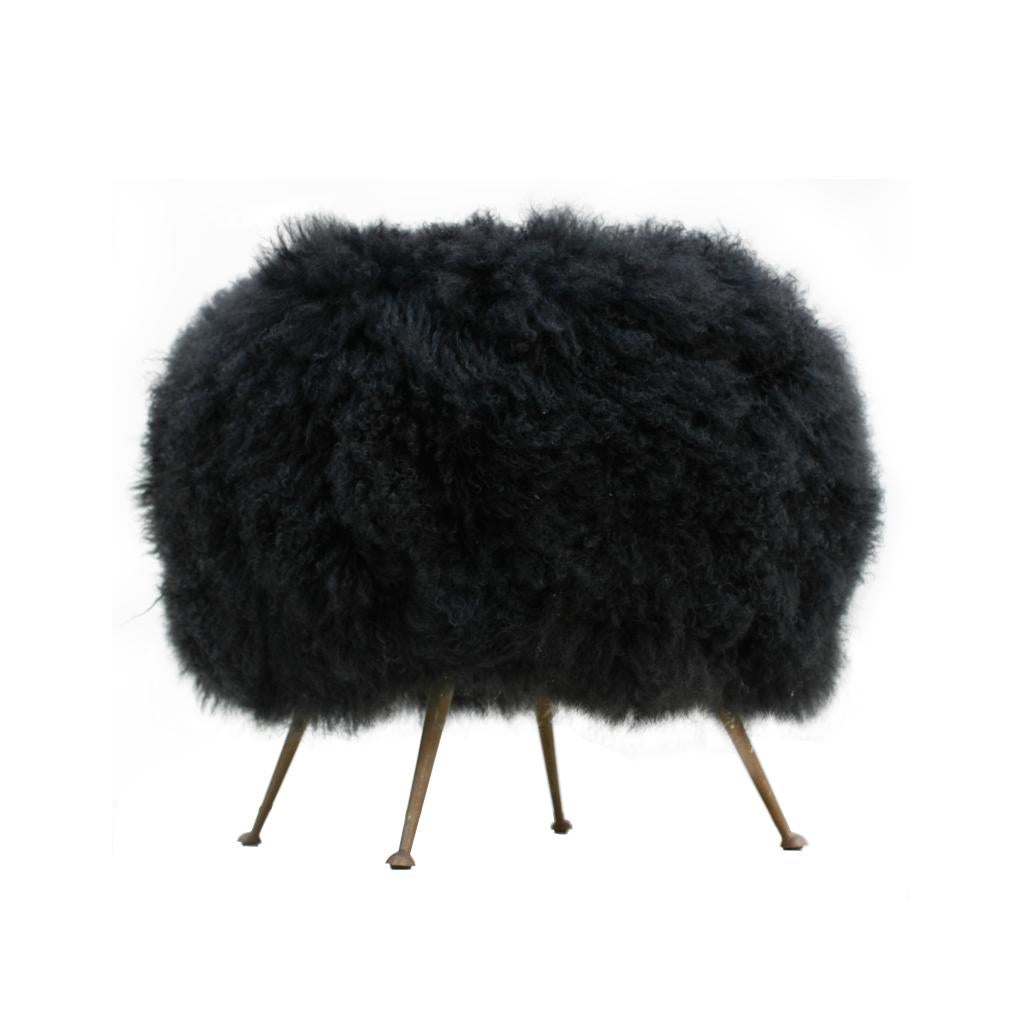 Italian footstool with structure made of solid wood upholstered in natural Mongolian goat fur. 
Legs made of brass.

 