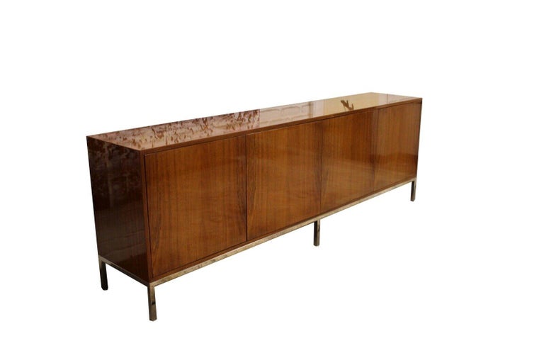 We present a truly fantastic long lacquer wood credenza with 4 doors, on chrome metal base Leon Rosen for Pace with the original tags. Circa 1980's. In excellent condition. Dimensions: 96