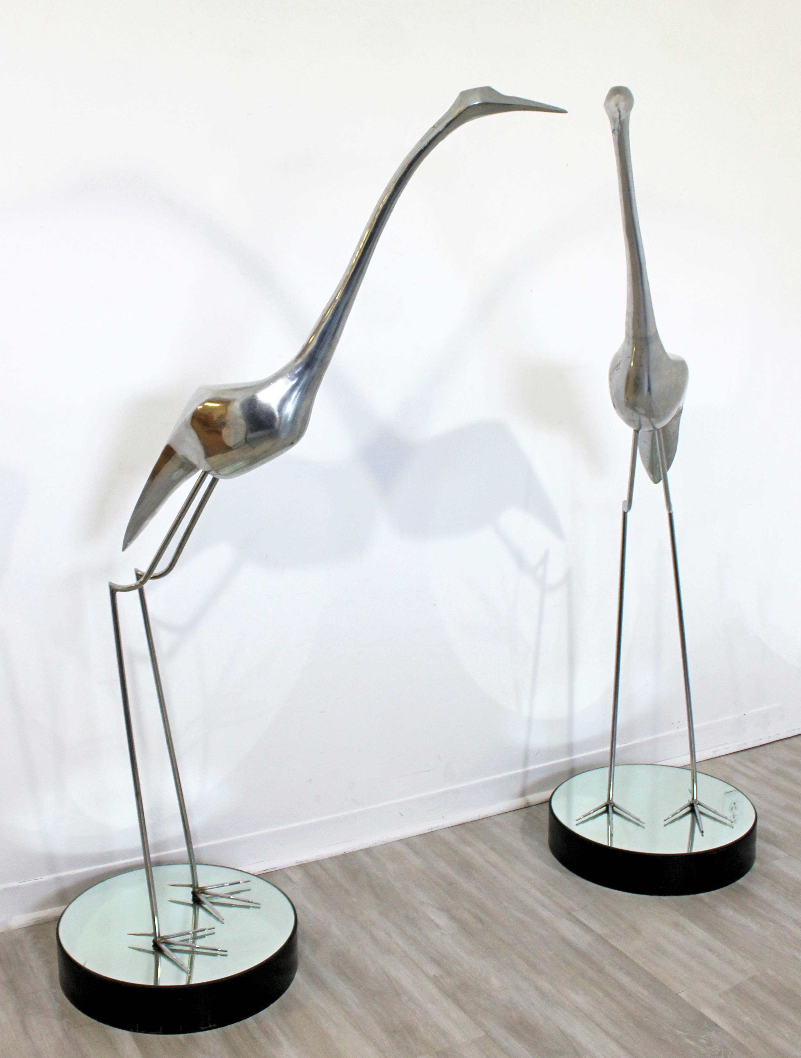 For your consideration is a monumental pair of aluminum and chrome floor sculptures of herons, by Curtis Jere, circa 1970s. In excellent vintage condition. The dimensions of each are 36