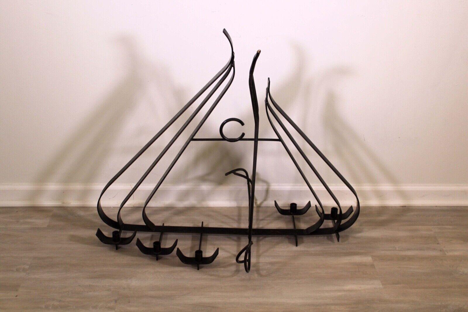 This unique danish floor table candle holder up for consideration. The wrought iron used to create this candle holder gives it the ultimate handmade look. This piece would fit beautifully in any home! In very good condition. Dimensions: 38