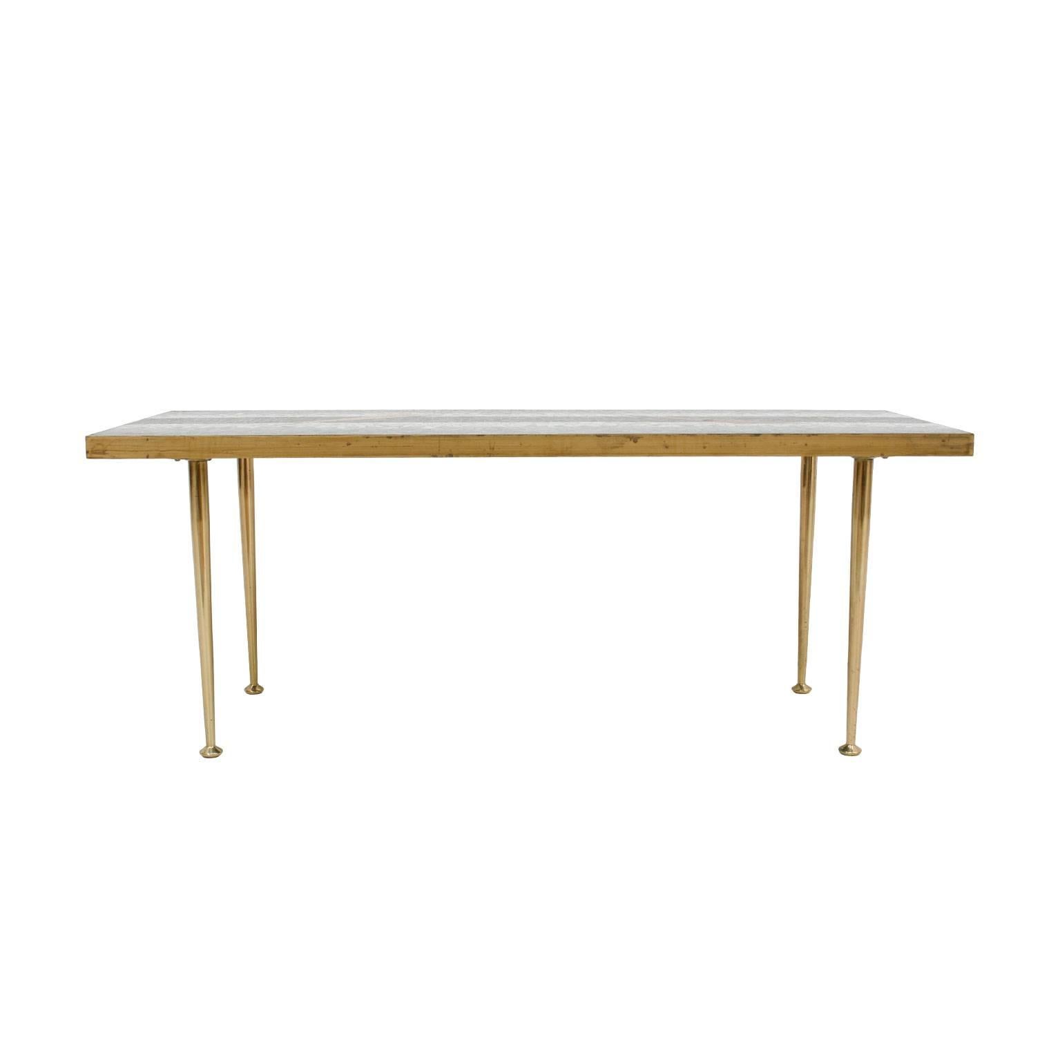Mid-Century Modern center table. Structure made of brass with mosaic top.
Wien, 1950.

 