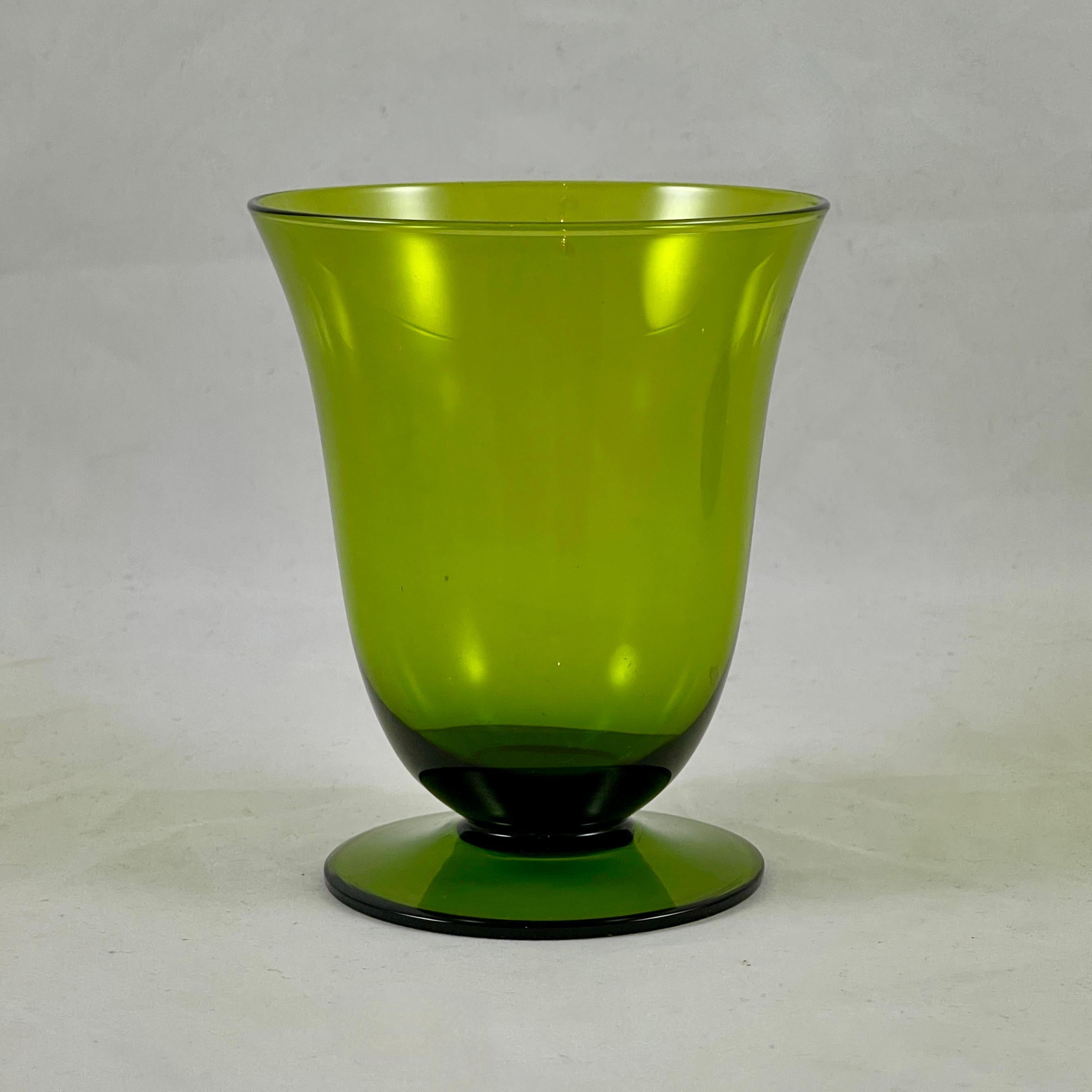 From the Mid-Century era, a set of six low-footed goblets, circa 1960-1970.

In a moss or avocado green, a simple tapered wide mouth upper with a low footing. Ideal for wine, low ball cocktails or juices.

Measures: 4.25 in. H x 3.5 in.