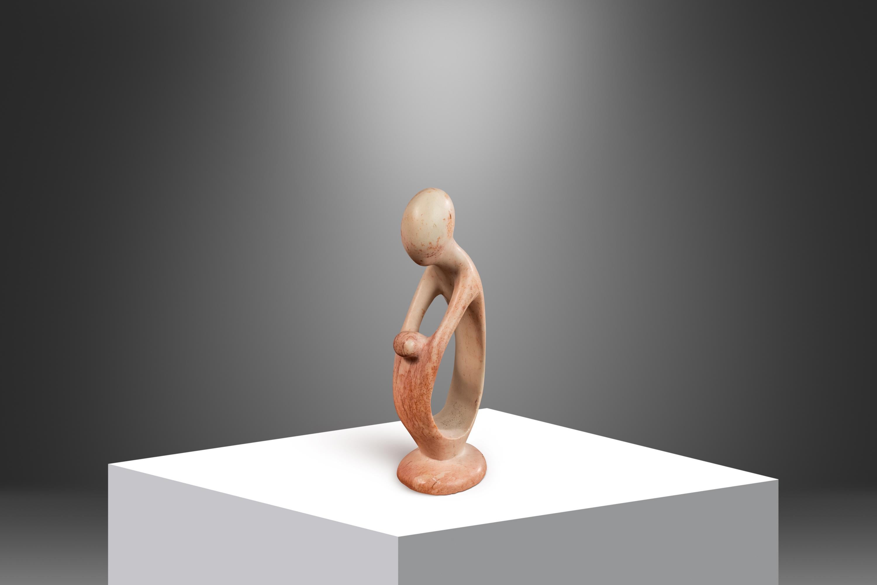 Introducing a heart-warming abstract sculpture depicting a parent with child in embrace. Hand-carved in solid marble by a Kenyan artisan this exquisite, petite sculpture is the perfect gift to new parents or for collectors searching for a unique,