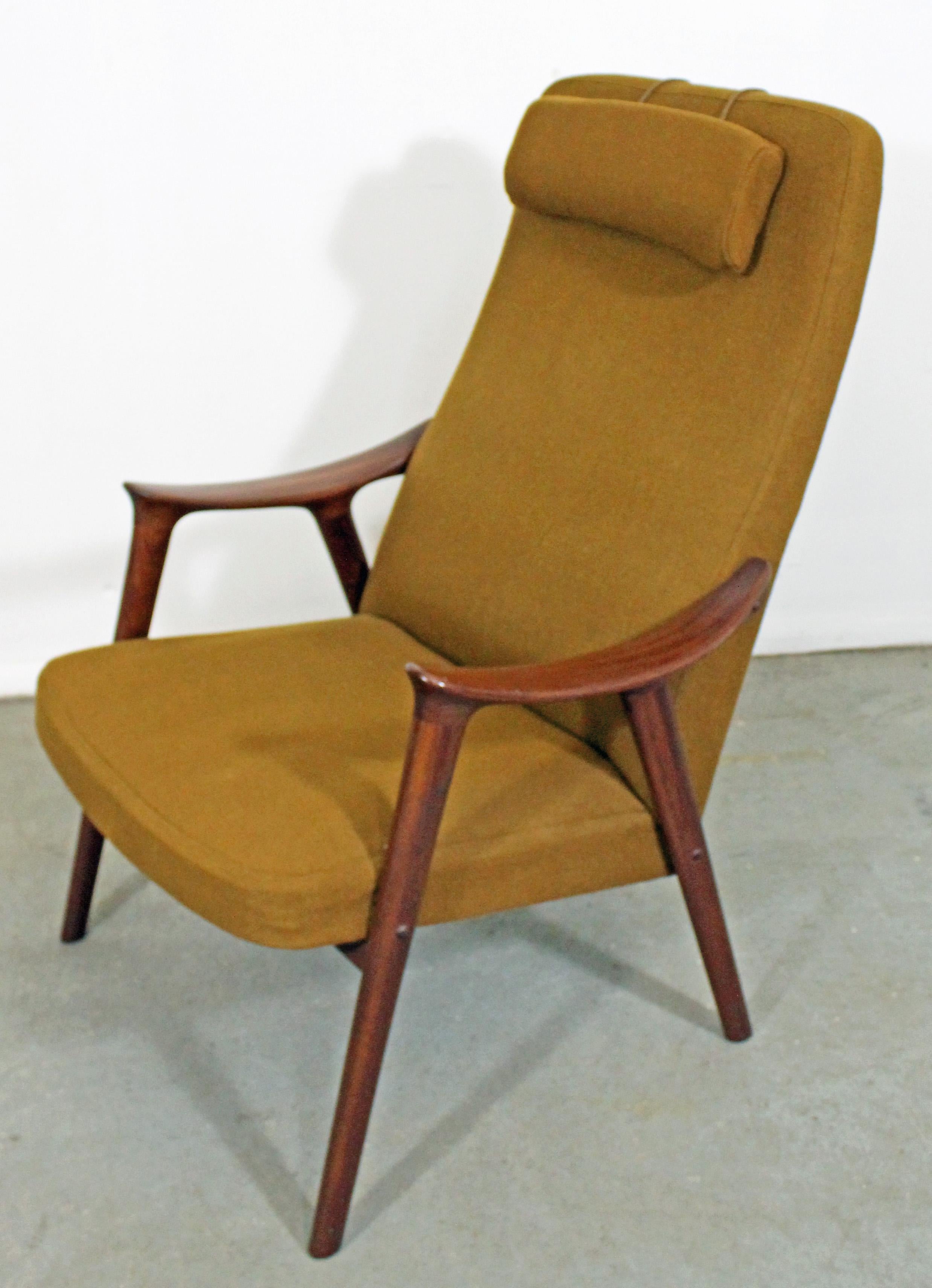 Offered is a 1950s Scandinavian Modern 'Klarinett' lounge chair by Møre Lenestol Fabrikk A/S. It is made of teak wood with a newly re-cushioned and removable, weighted headrest. It is in decent vintage condition, showing some age wear (small tear in