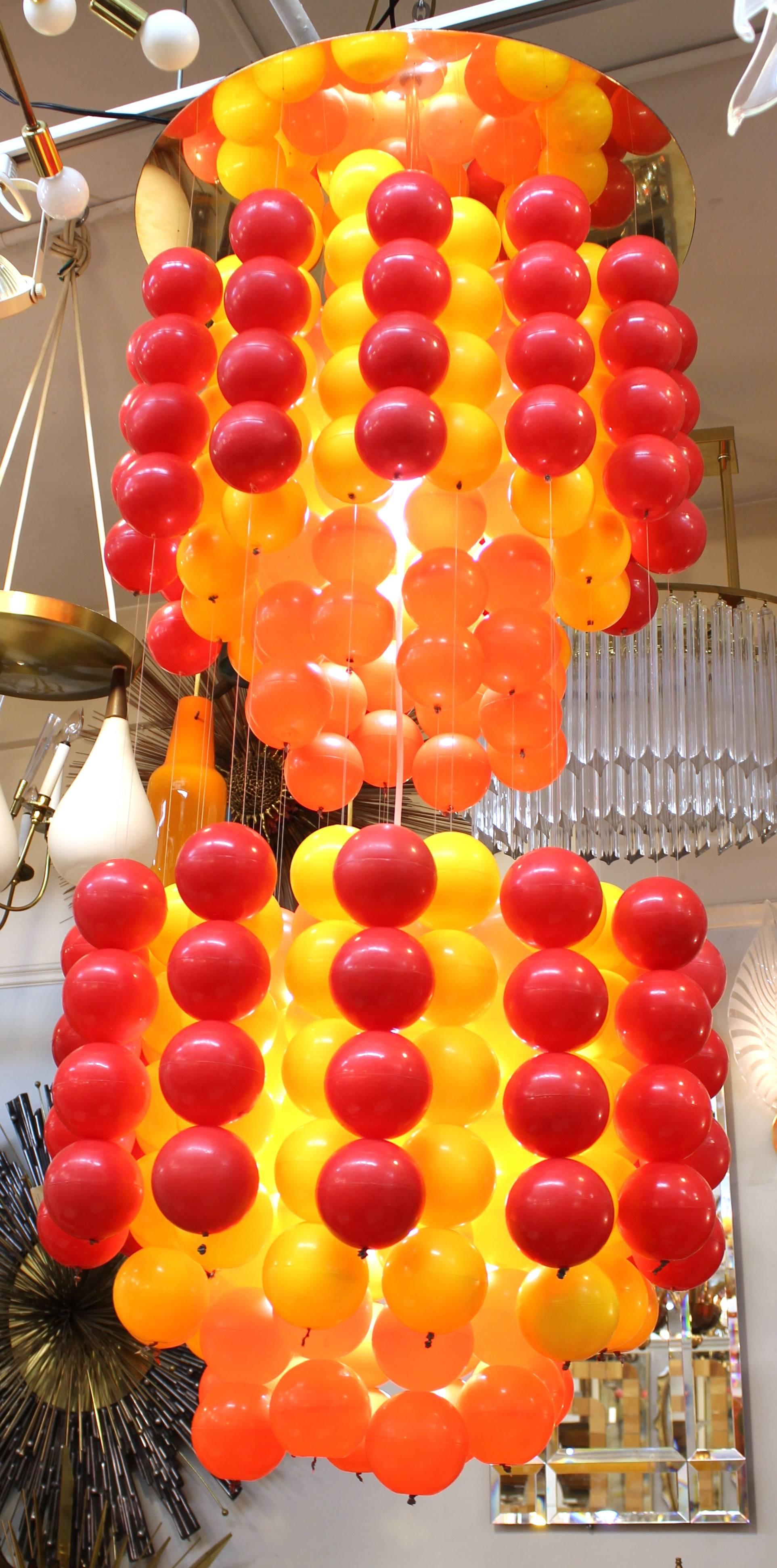 A Mid-Century Modern Verner Panton chandelier made of layers of multicolored vinyl balls. The piece was made in the 1970s and is in good vintage condition.
