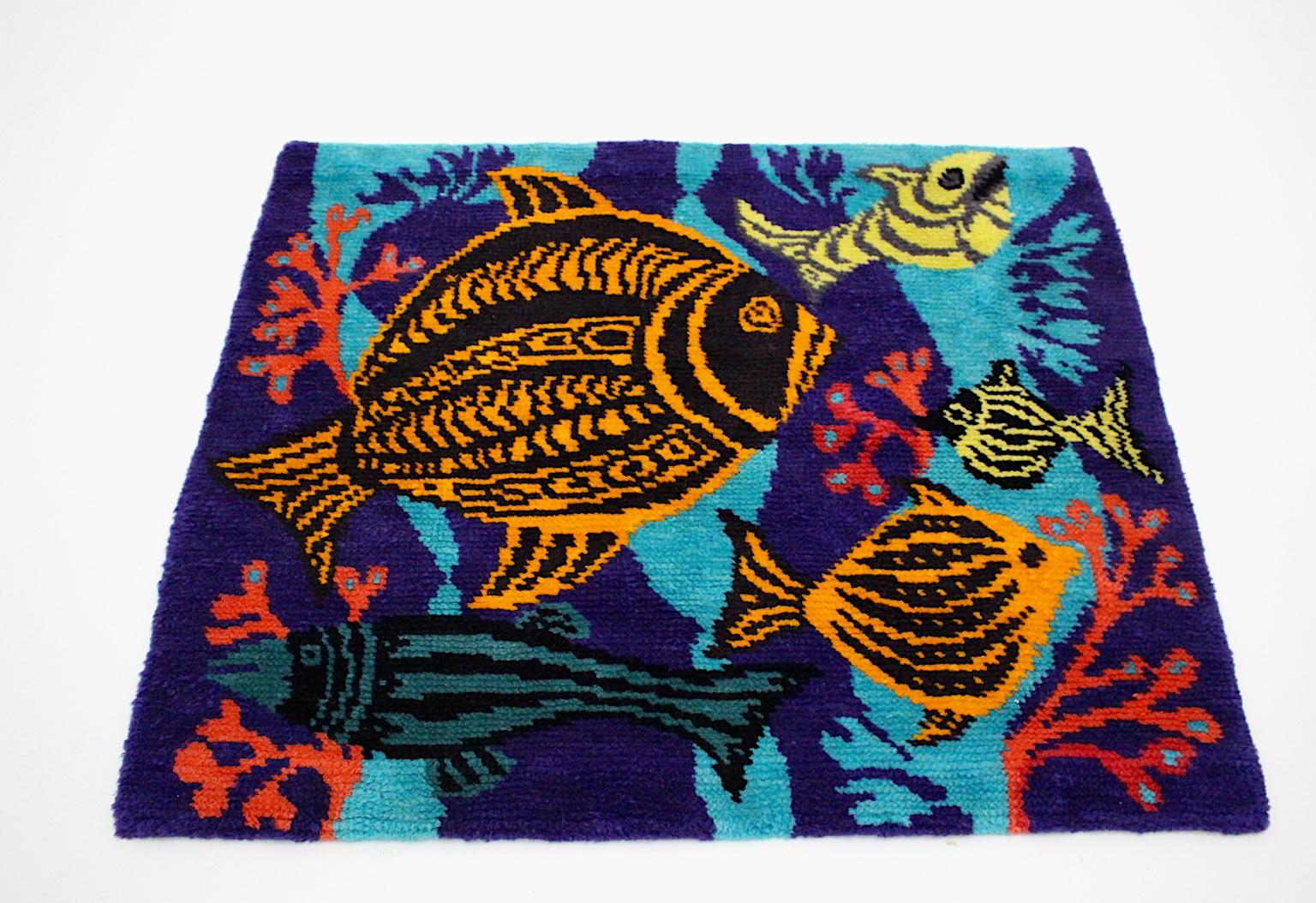 An amazing handmade vintage wall carpet or floor carpet, which was designed and handmade in Austria 1960s.
Lovely animal pattern with five fishes in brightly colors blue, yellow, red, orange and black.
The carpet was made out of wool by hand.
We