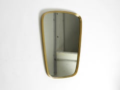 Mid Century Modern "Münchener Zierspiegel" wall mirror with heavy brass frame