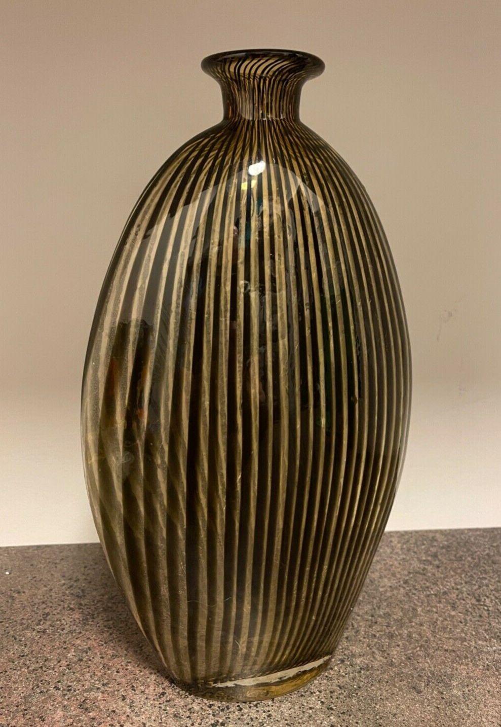 Large Mid-Century Modern Murano hand blown designer art glass vase. Amber and back stripes. Abstract Studio Style. Italy. Circa: 1950s. Approx. Dimensions: 13.25” tall x 8” wide x 4” deep. Beautifully designed! top quality handcrafted Art glass