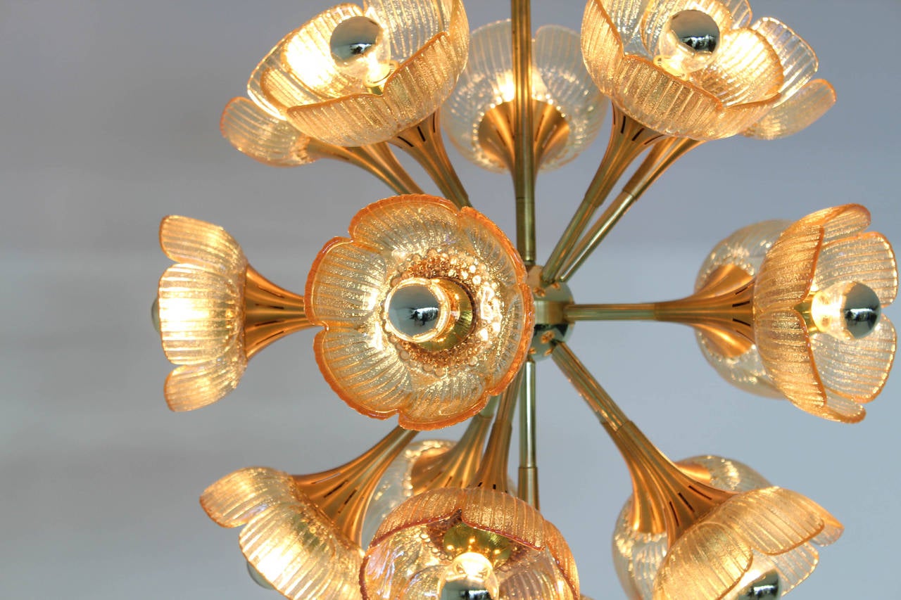 Stunning and rare Mid-Century Modern chandelier in the style of Gaetano Sciolari.
Striking Italian design from the 1960s.
Brass and gold-plated metal frame with 16 original Murano glass shades.
All shades in perfect condition.
 