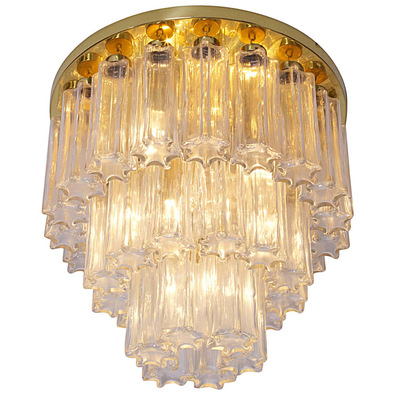Limburg Murano clear beige glass flush mount chandelier.
Venini Murano glass pendants, each with brass fittings.
Brass ceiling plate.
Italy, 1965-1969.
6 lights, rewired for the US
In excellent condition.