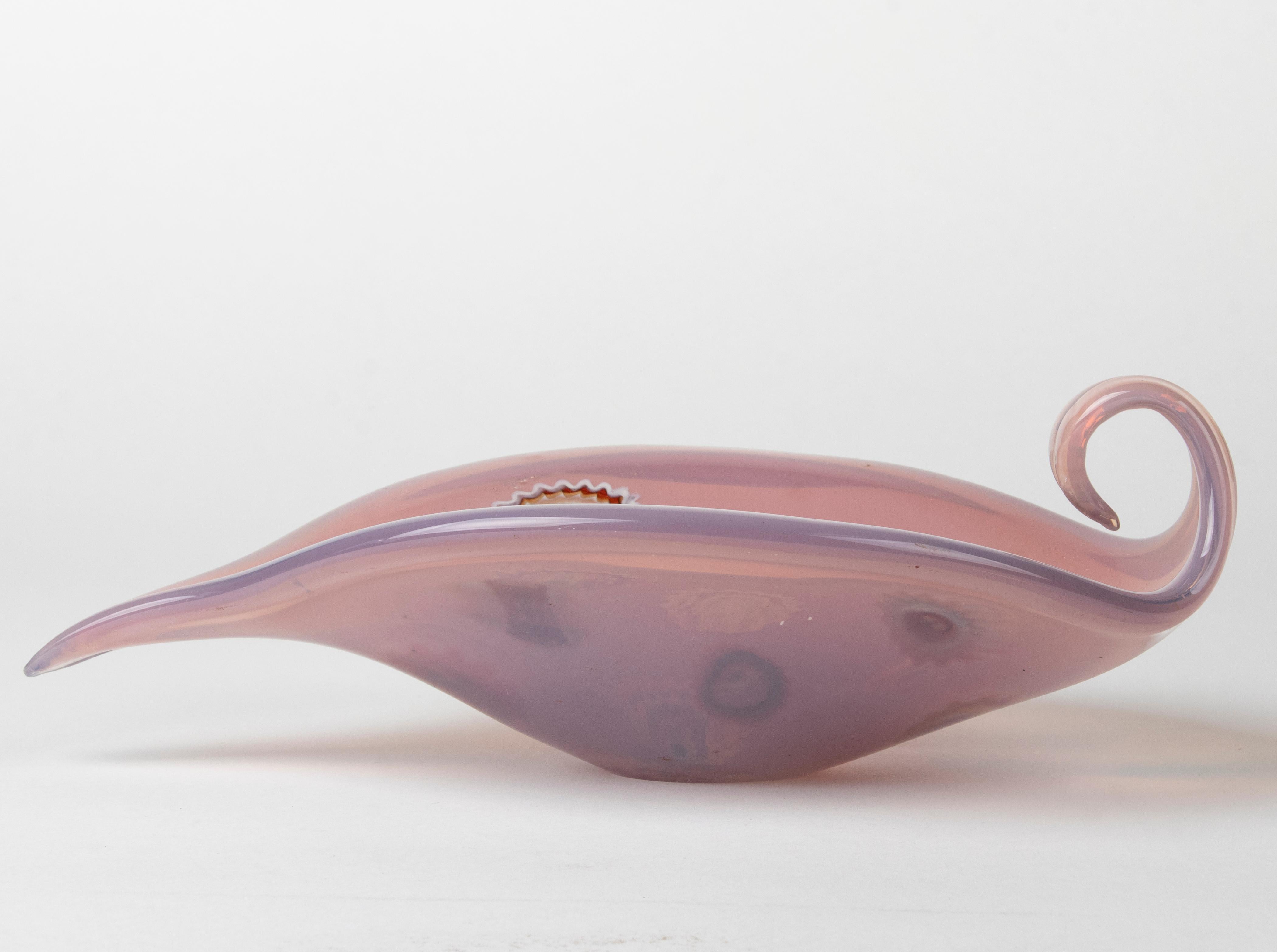 Decorative Murano glass bowl in a free, curled shape. The color is somewhere between pink and purple, decorated with so-called 'millefleurs' decorations. In good condition, no defects.