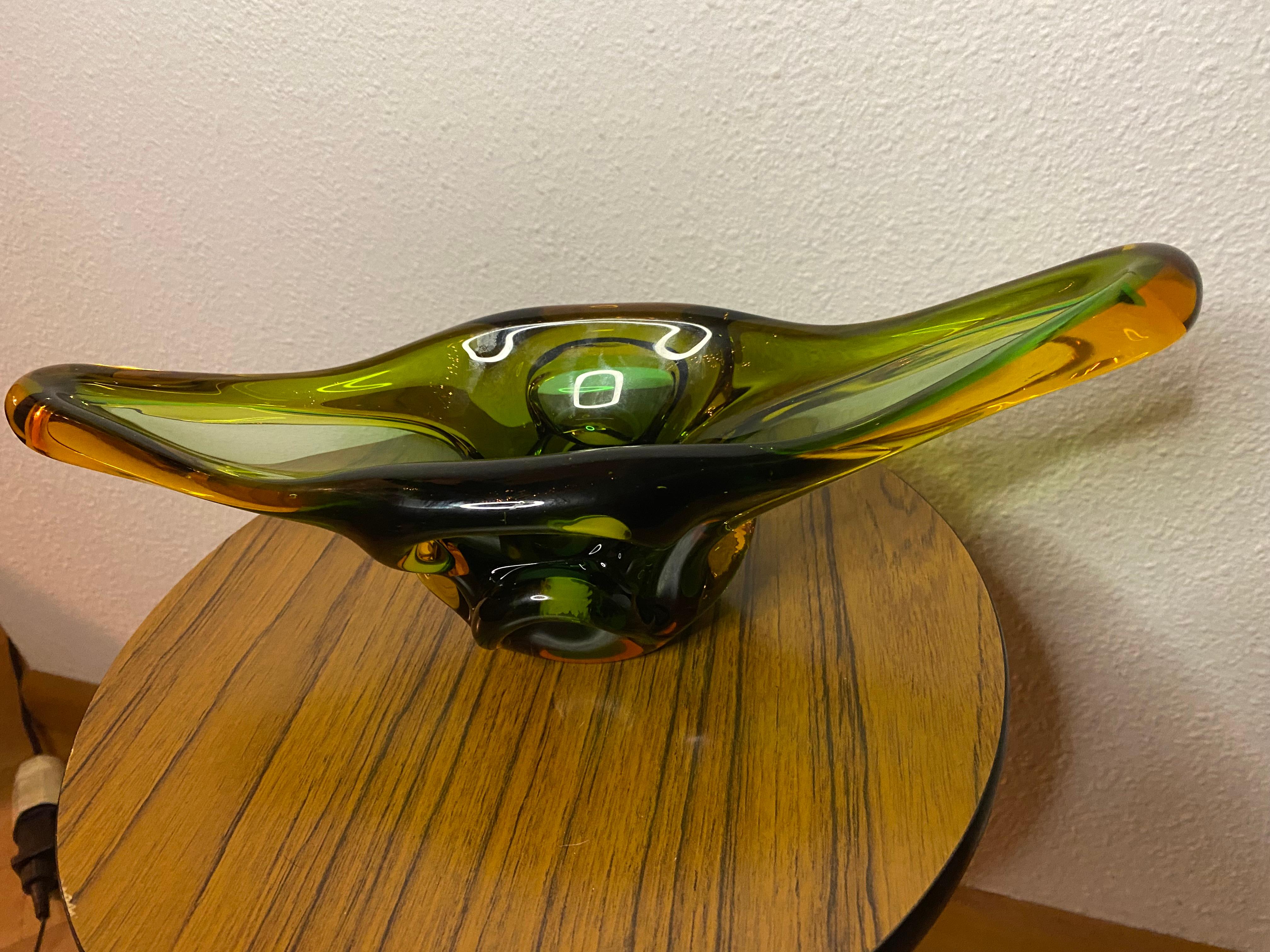 Stunning green and amber colored Murano glass  bowl in a beautiful shape.