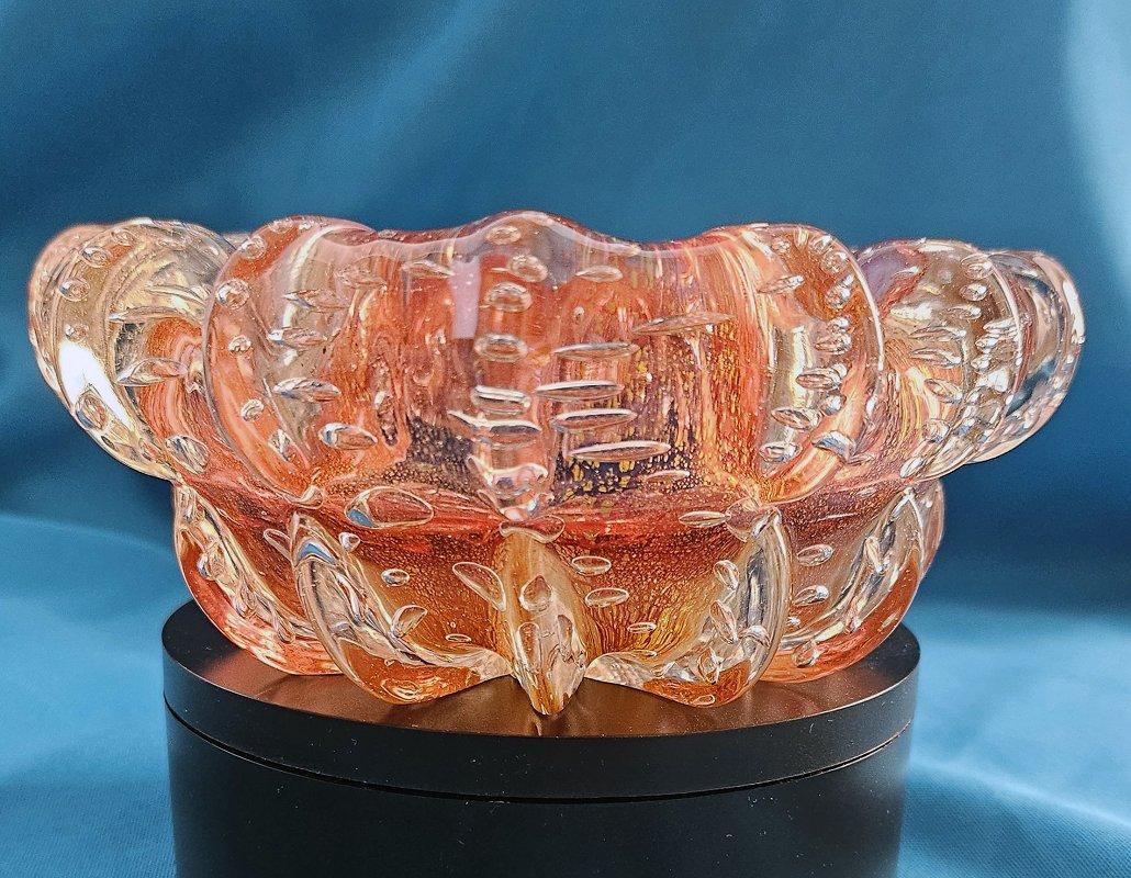 Mid-Century Modern Murano Glass Bowl w/Gold Leaf & Bullicante, Barovier & Toso
 BeFirstBoldy com
Barovier & Toso created these as ash trays originally, but now that not so many people smoke, we view them as unique decorative bowls/vide-poche. 
This