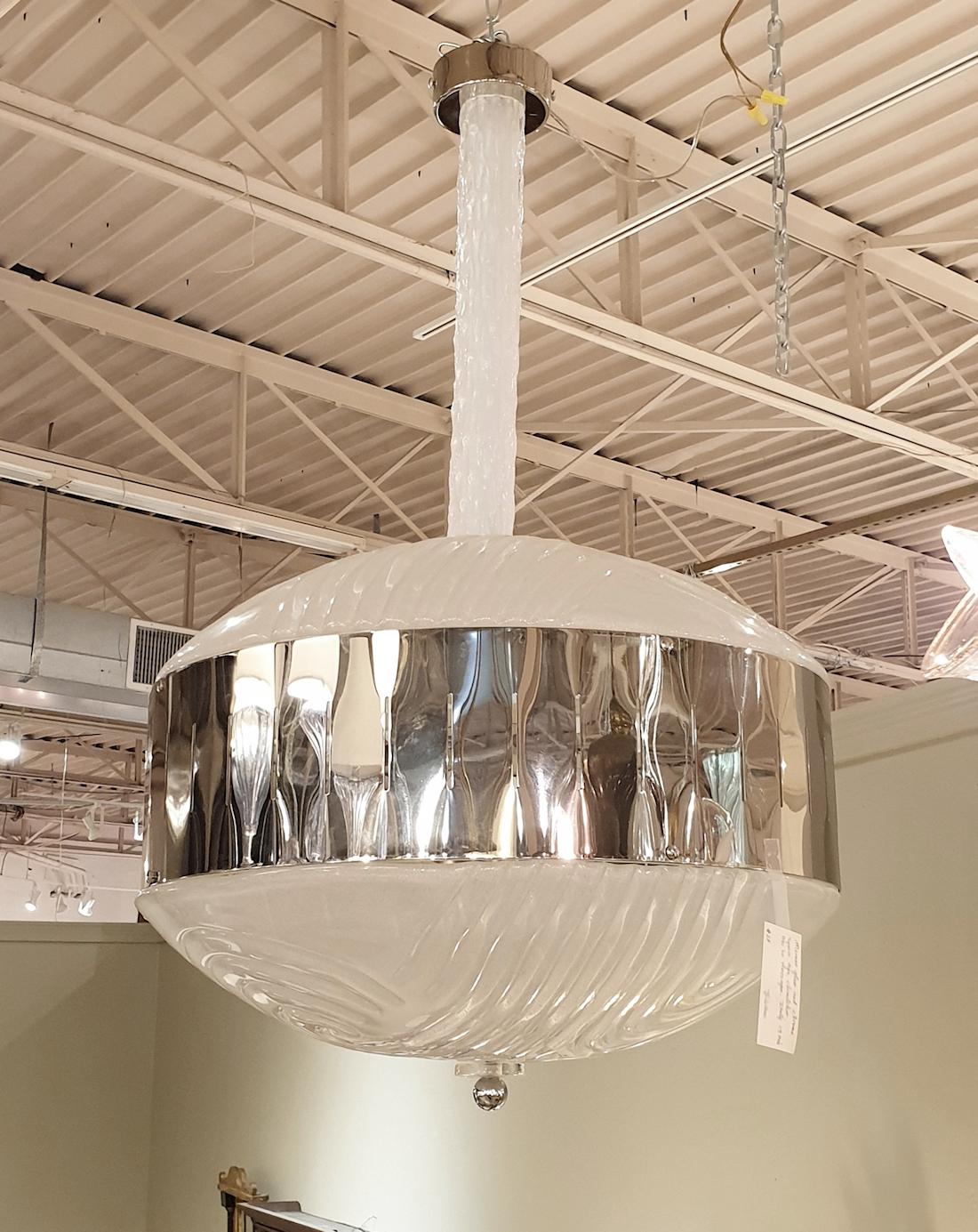 A large Space-Age Murano glass pendant light or chandelier, Italy circa 1970s, Mazzega style.
The Mid-century modern chandelier is made of Murano frosted glass and a chrome frame.
The top and bottom very large bowls and the center stem are made of