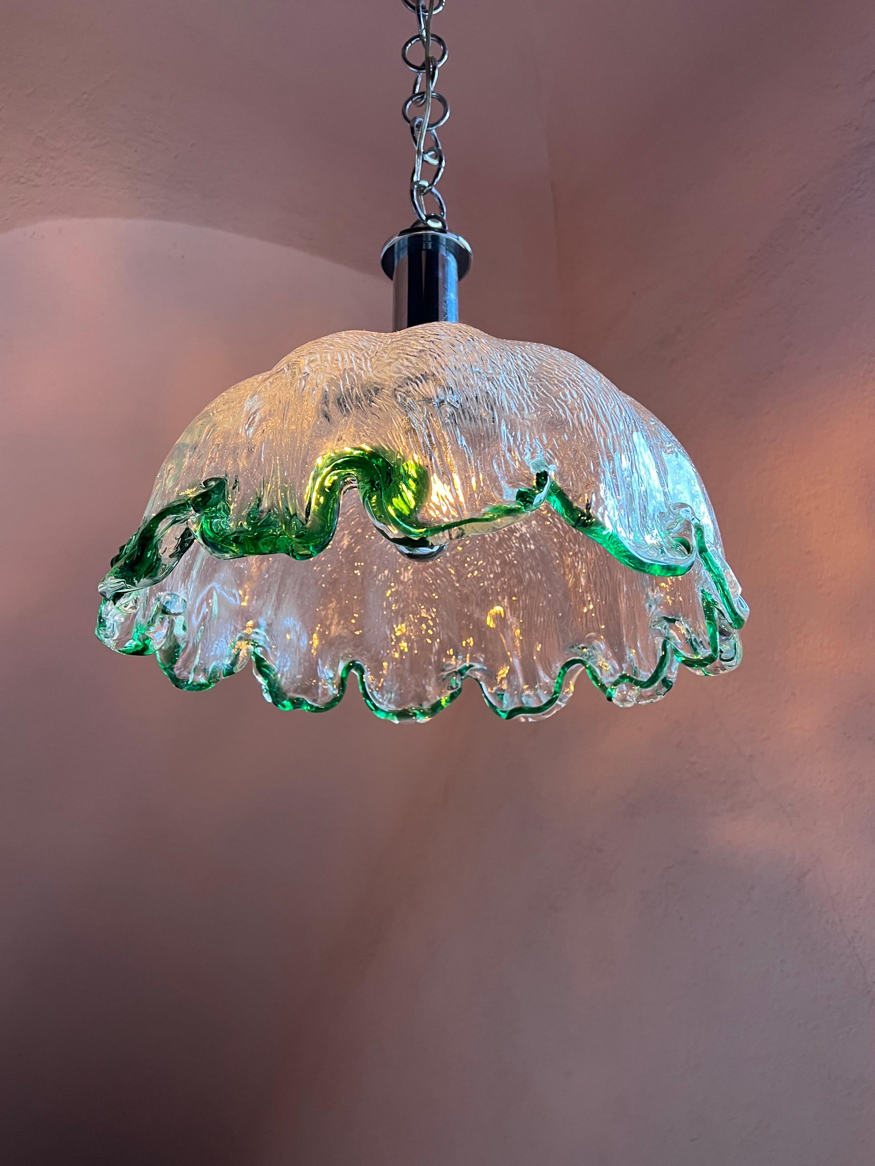 Mid Century Glass Pendant Lamp in Murano Glass by Carlo Nason for Mazzega

This stunning pendant lamp was crafted by Mazzega in the 1970s and showcases the finest in mid century Italian design. The glass itself has a beautiful texture with a refined