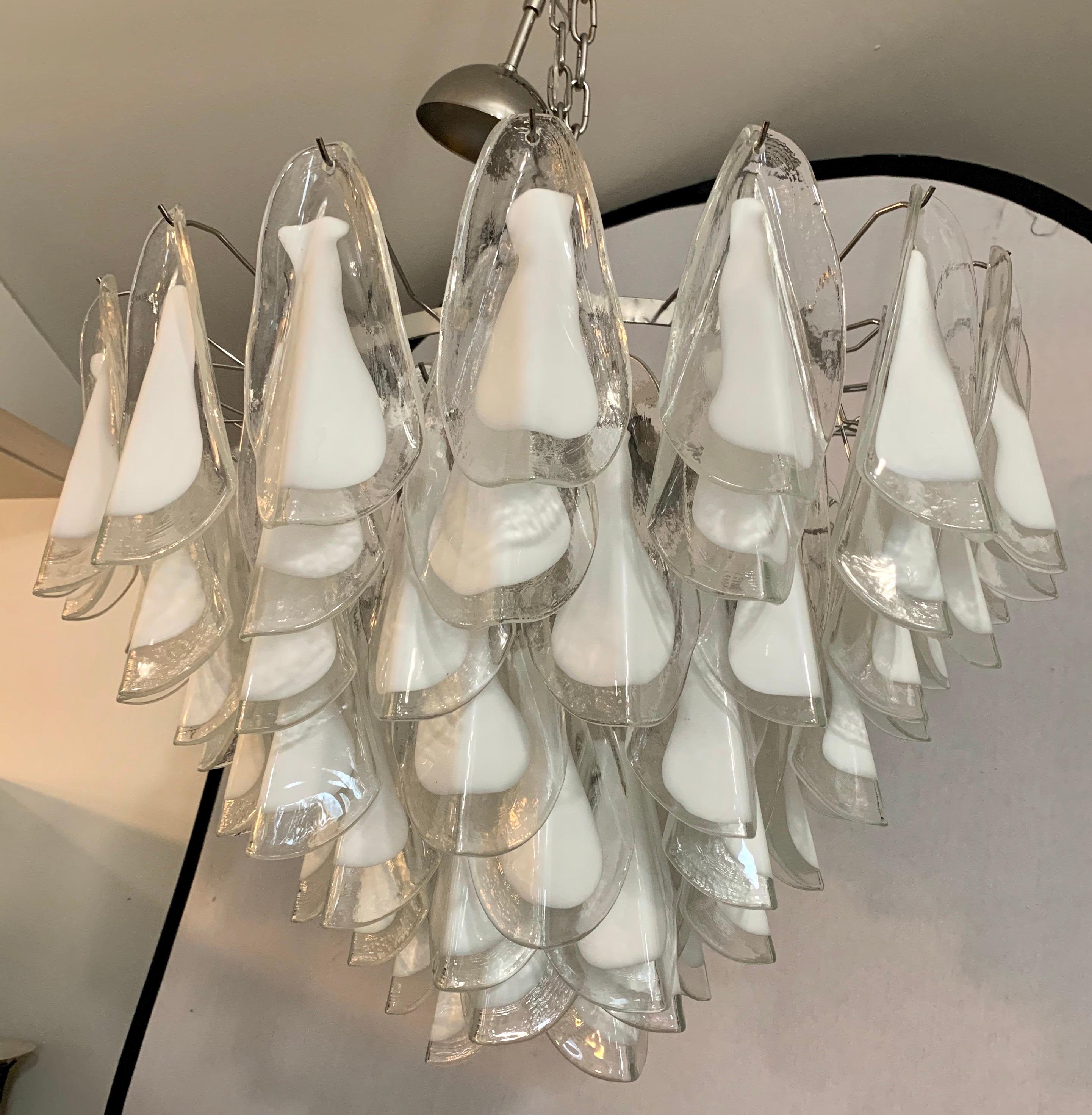 Stunning Mid-Century Modern Murano glass waterfall chandelier where the individual Murano glass
pieces are shaped like oyster shells. Nothing short of magnificent. Wired for USA and in working order. Now, more than ever, home is where the heart is.