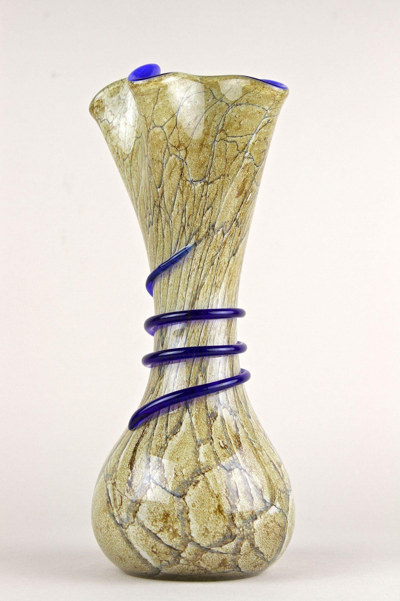 Excitingly designed, unusual late mid century Murano glass vase from the mid 1970s. Artfully handmade by the famous glass artist on this well known little island near Venice, this extraordinary looking Murano vase has been made using the so-called
