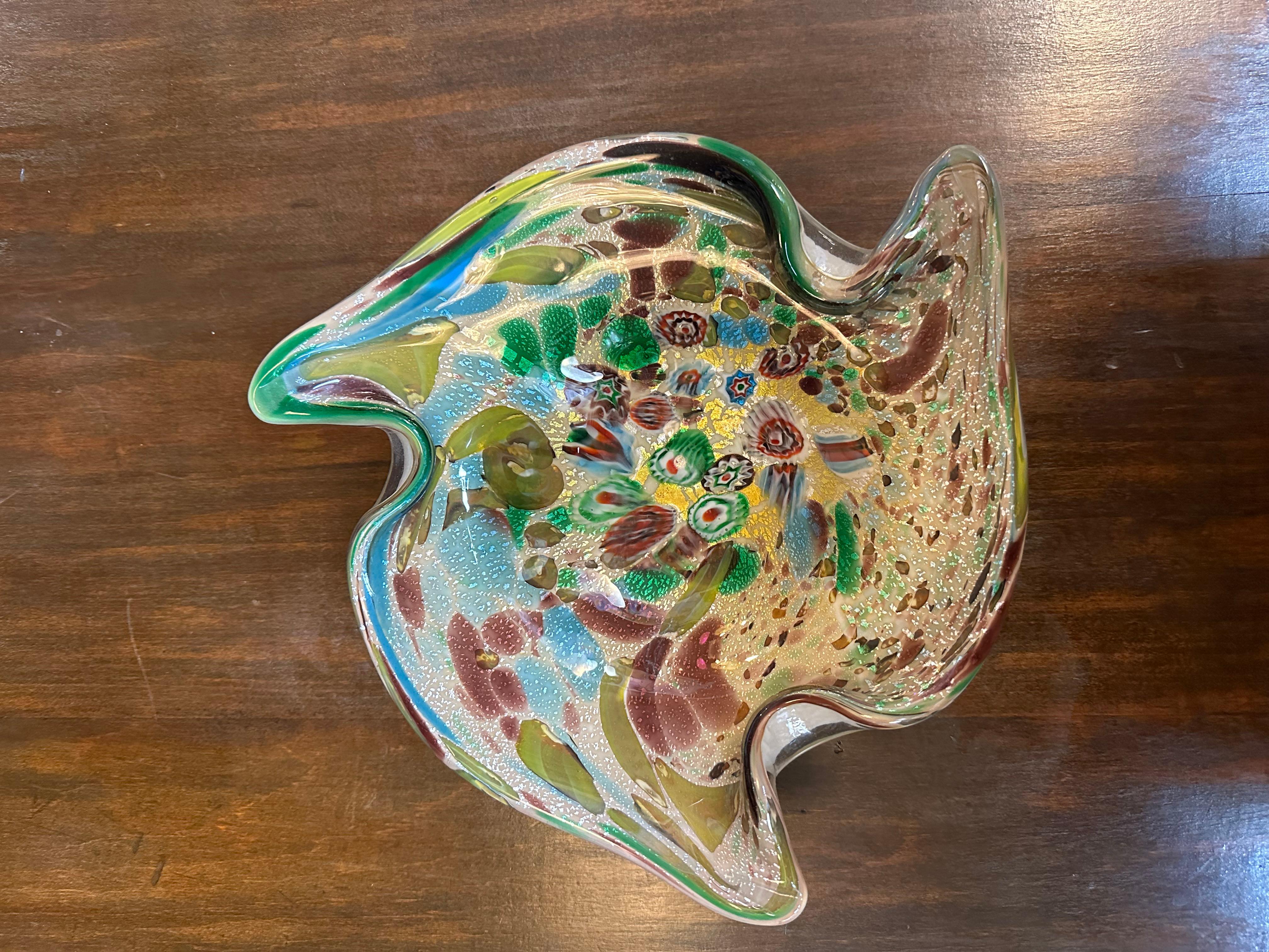 Mid-Century Modern Murano Italian Art Glass Ashtray Bowl

Unusual Murano glass bowl with swirls colors. White underside and interesting organic shape.

circa 1960

H 2.5”
D 10”.