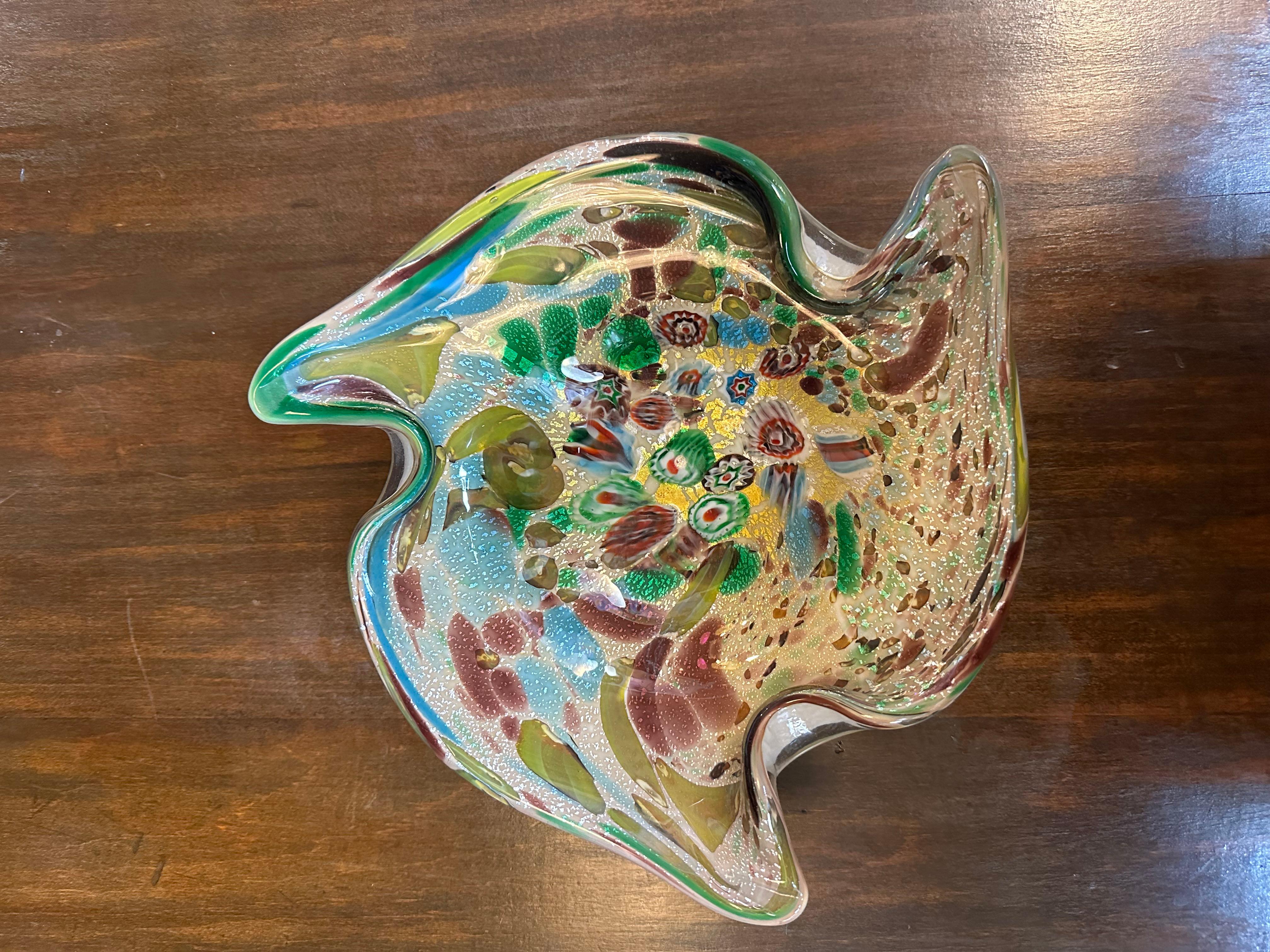Mid-Century Modern Murano Italian Art Glass Ashtray Bowl

Unusual Murano glass bowl with swirls colors. White underside and interesting organic shape.

