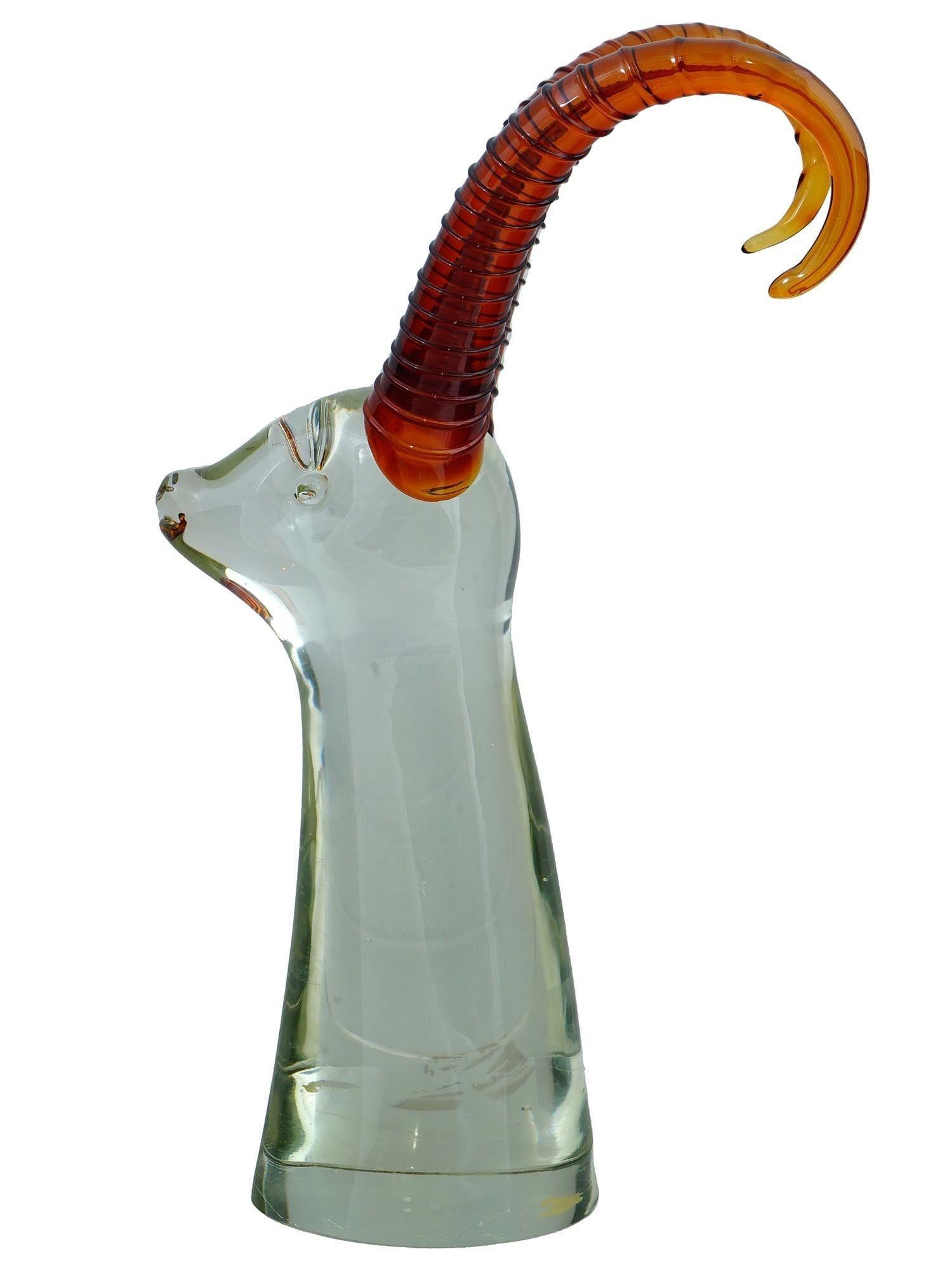 Very large mid-century hand-blown Murano glass sculpture depicting the bust of an antelope in clear glass with amber colored horns.  With its original paper label from the studio, Alvin. 18 3/4 inches tall and in very good condition.
