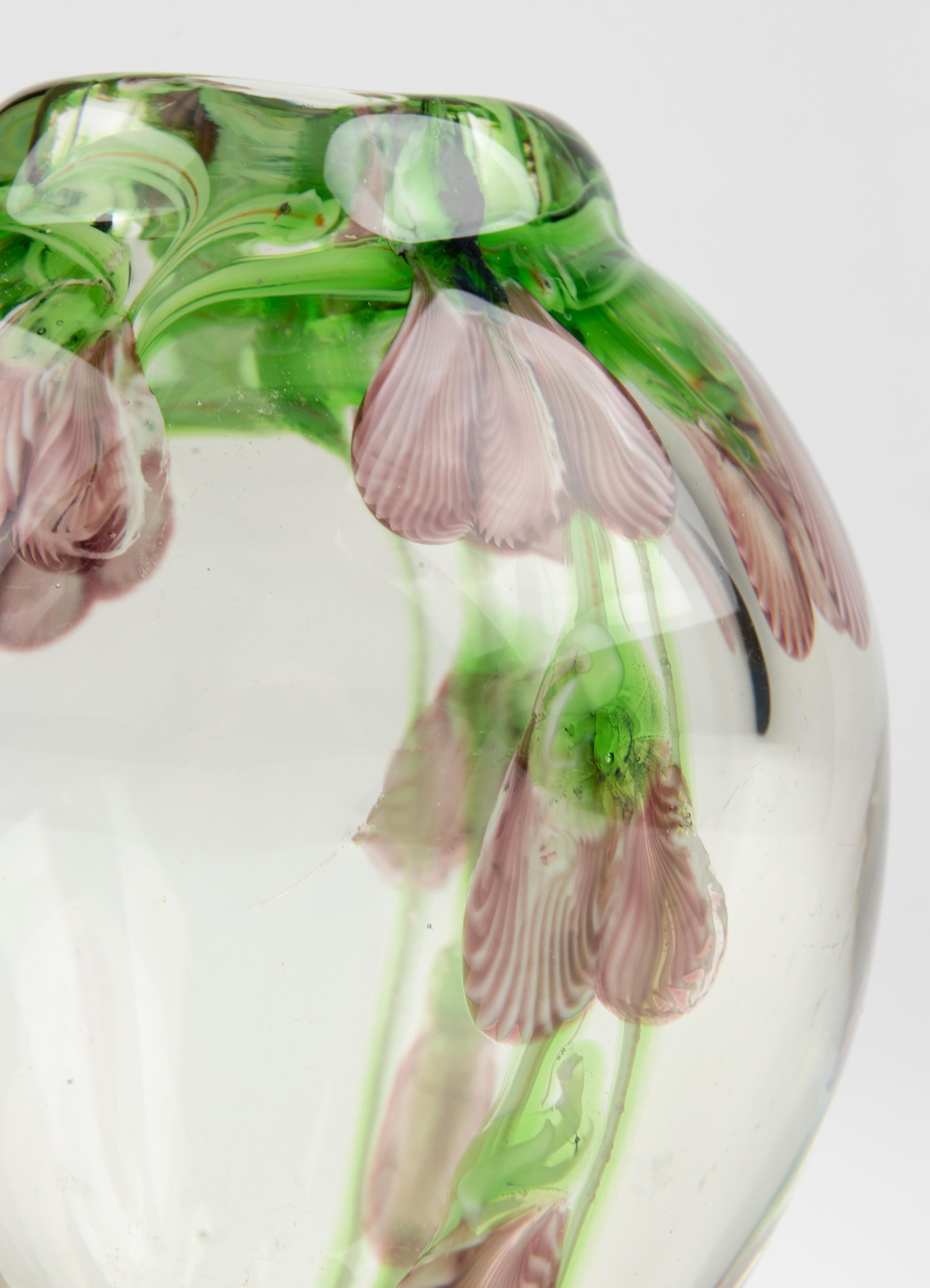 Mid-Century Modern Murano vase, thick-walled glass with embedded flower decorations. It is a single flower vase, beautiful from every point of view.