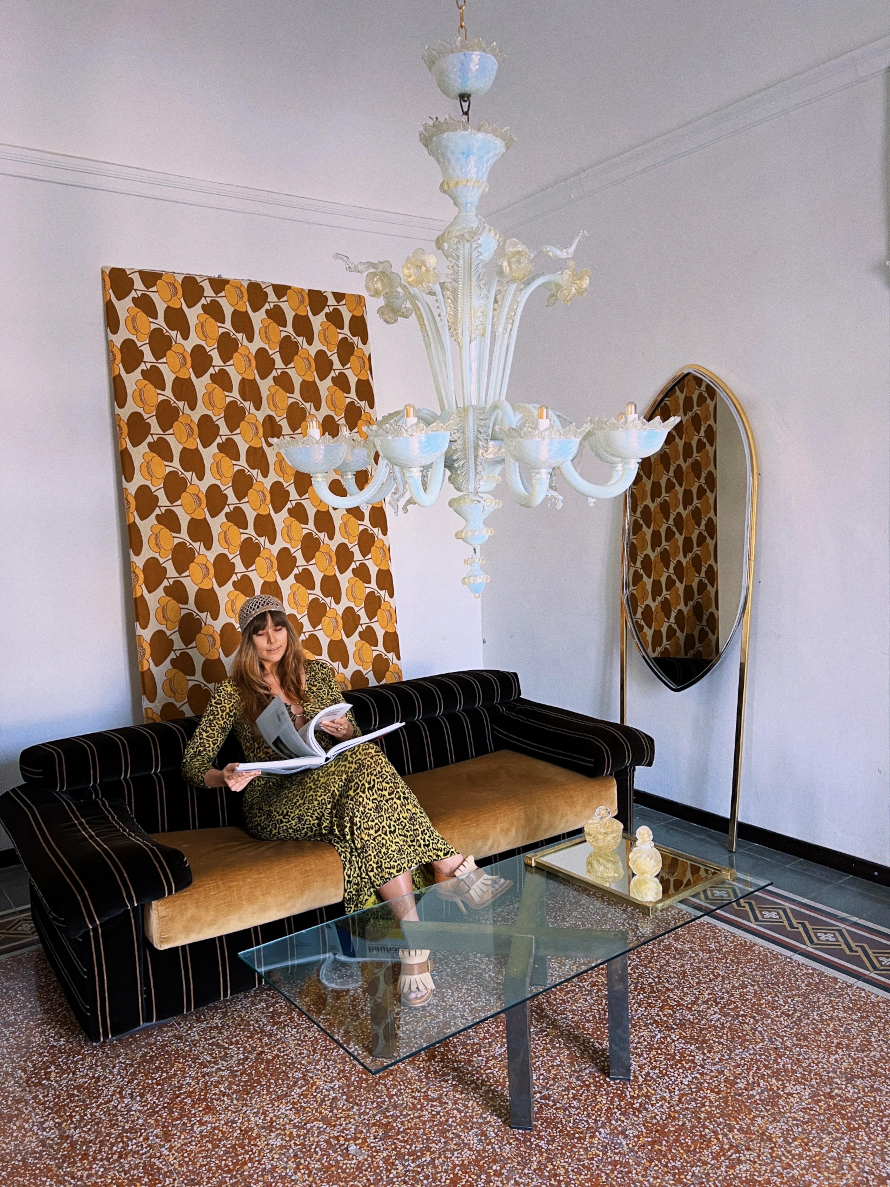 Murano Glass Floral Rezzonico Chandelier 1960s

This stunning chandelier is a remarkable example of Venetian craftsmanship from the 1960s. Expertly handcrafted from Murano blown glass it features a central structure with eight graceful arms each