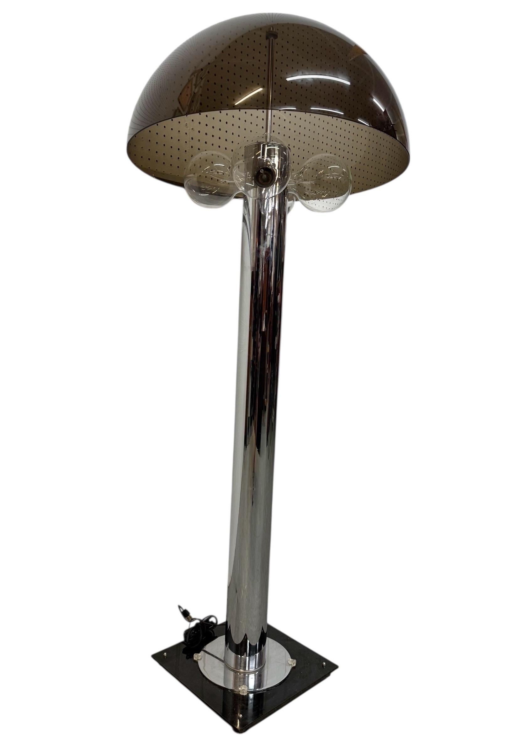 This listing is for a Mid-Century Modern Mushroom Chrome Floor Lamp. Featuring a smoked plastic mushroom shaped lamp shade, cylinder chrome body, four light bulbs, square smoked plastic base, and original cord. This is an exceptional combination of
