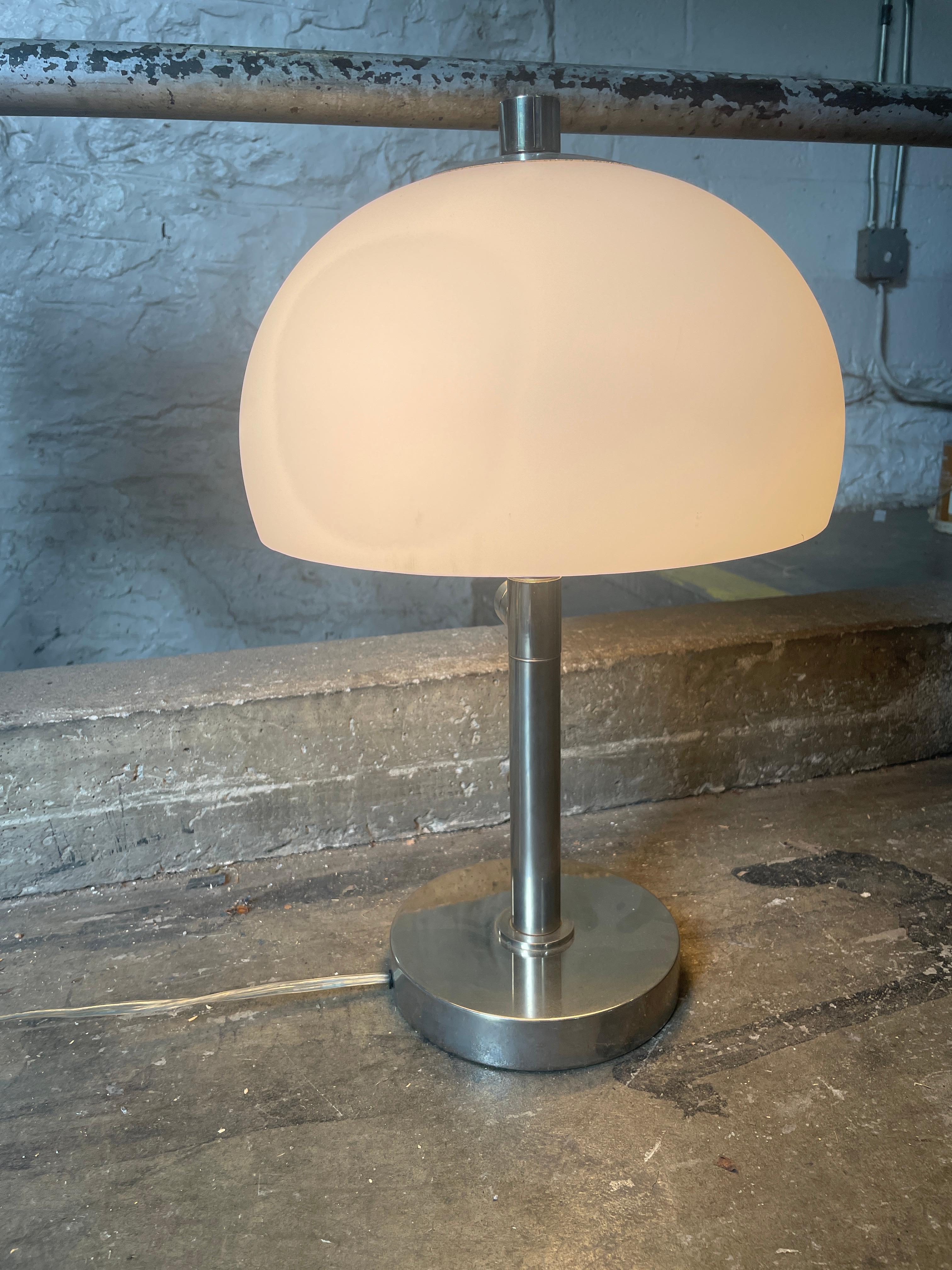 Mid-Century Modern mushroom style frosted glass an nickel table lamp. Dimmer built in to switch - takes 2 Edison bulbs with American 2 prong plug. Works 100% located in Brooklyn NYC.

Measures 13” diameter x 20” high.