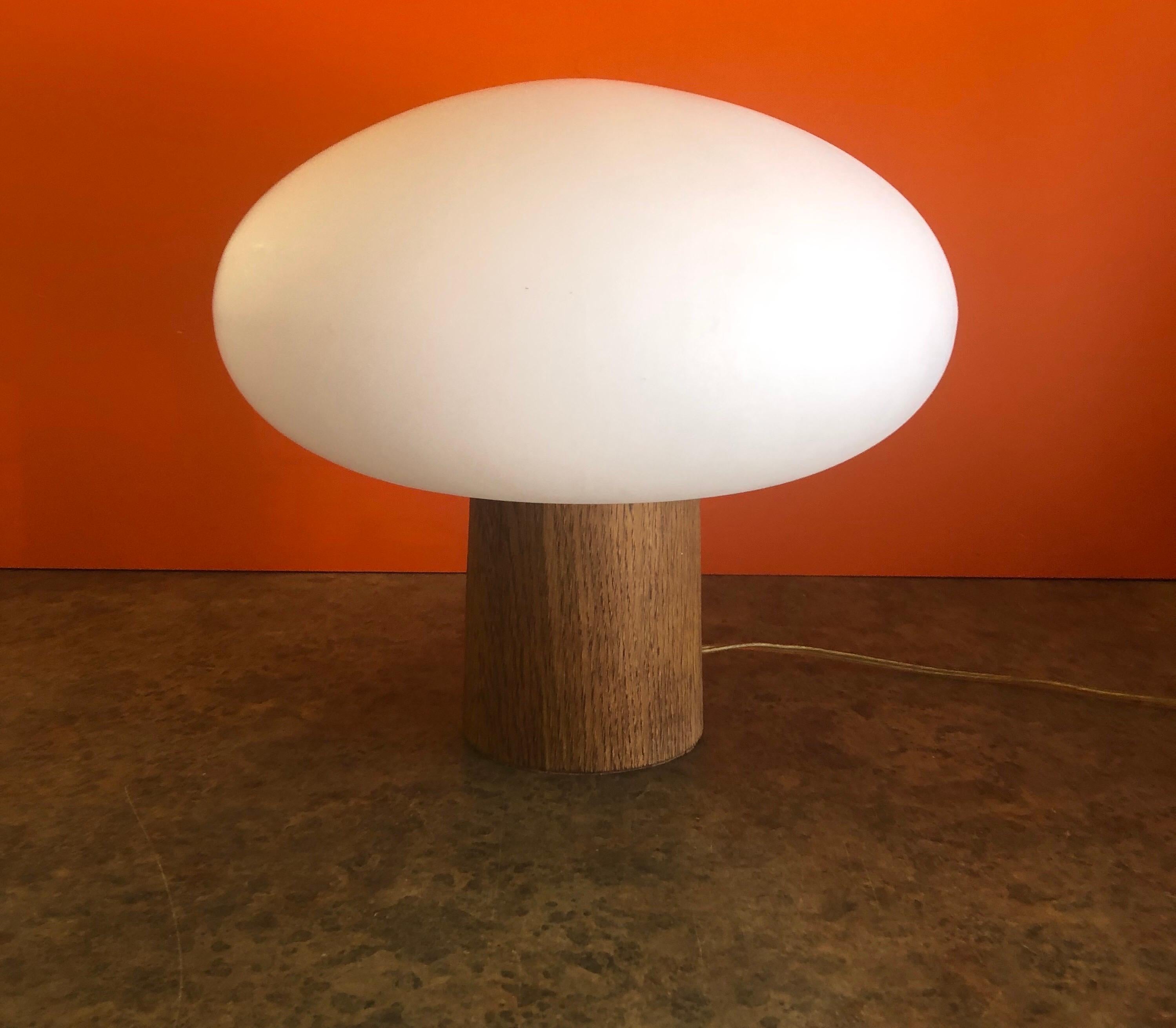 Highly collectible MCM mushroom table lamp on a solid teak base by Laurel Lamp Co., circa 1960s. The Italian mouth blown frosted glass mushroom shade is 12.5