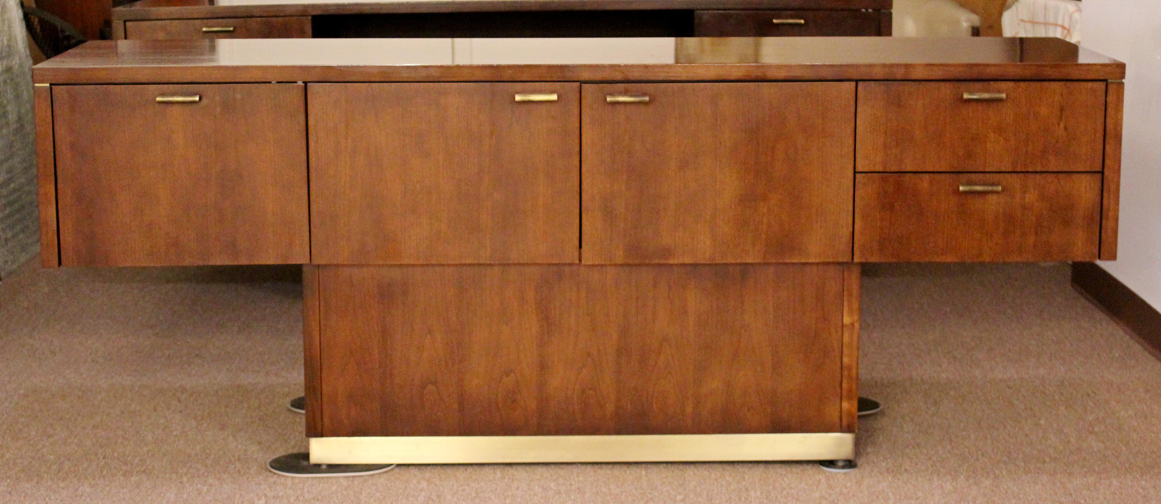 For your consideration is a magnificent, cabinet credenza set, made by Myrtle Desk, with brass trim and pulls, circa 1960s. In excellent condition. The dimensions are 76