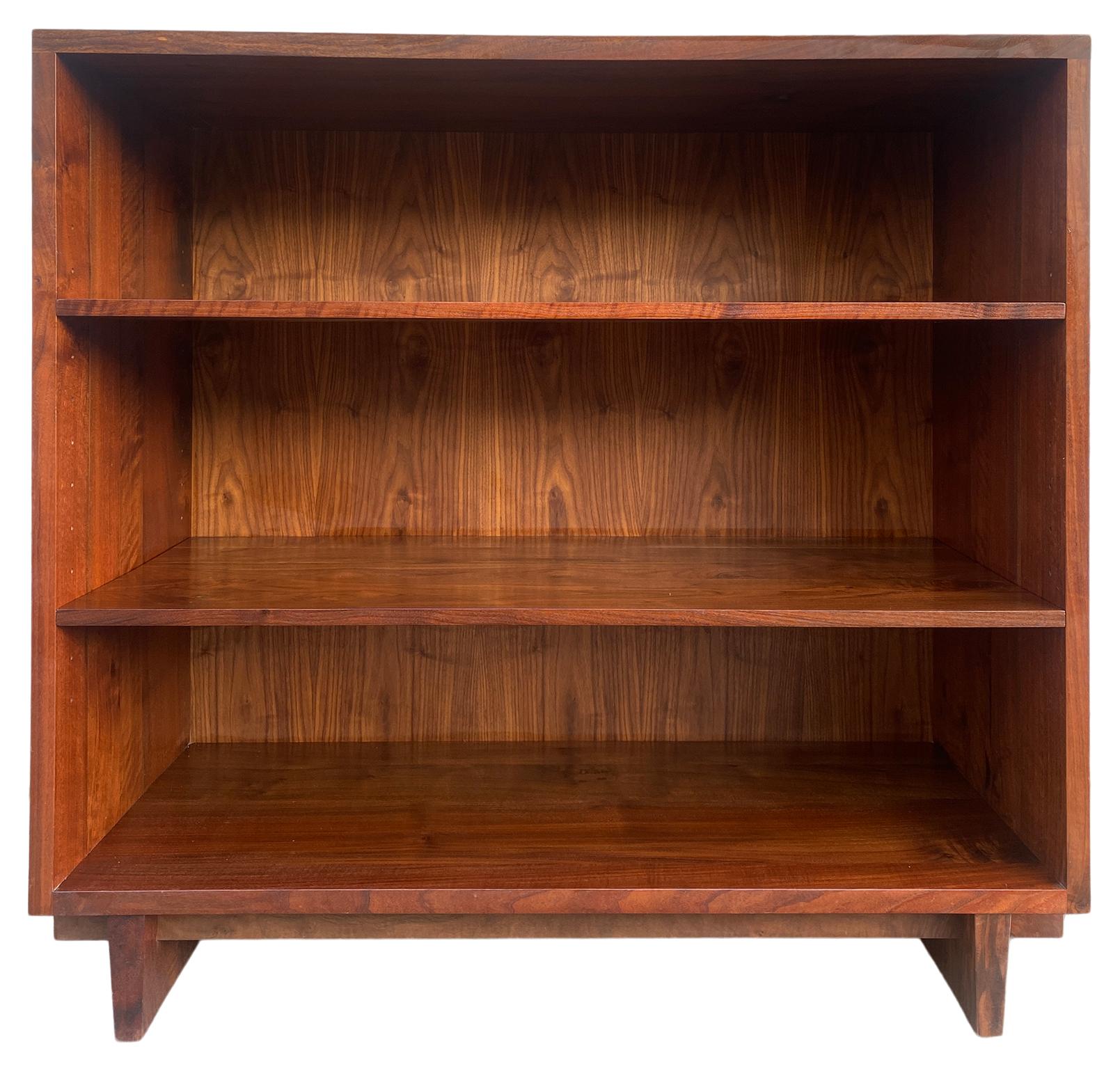 Vintage Mid-Century Modern in the style of George Nakashima large deep bookcase made of solid black walnut American Studio craft joinery. Beautiful large bookcase custom made walnut bookcase, 2 adjustable shelves on brass pins, beautiful solid black