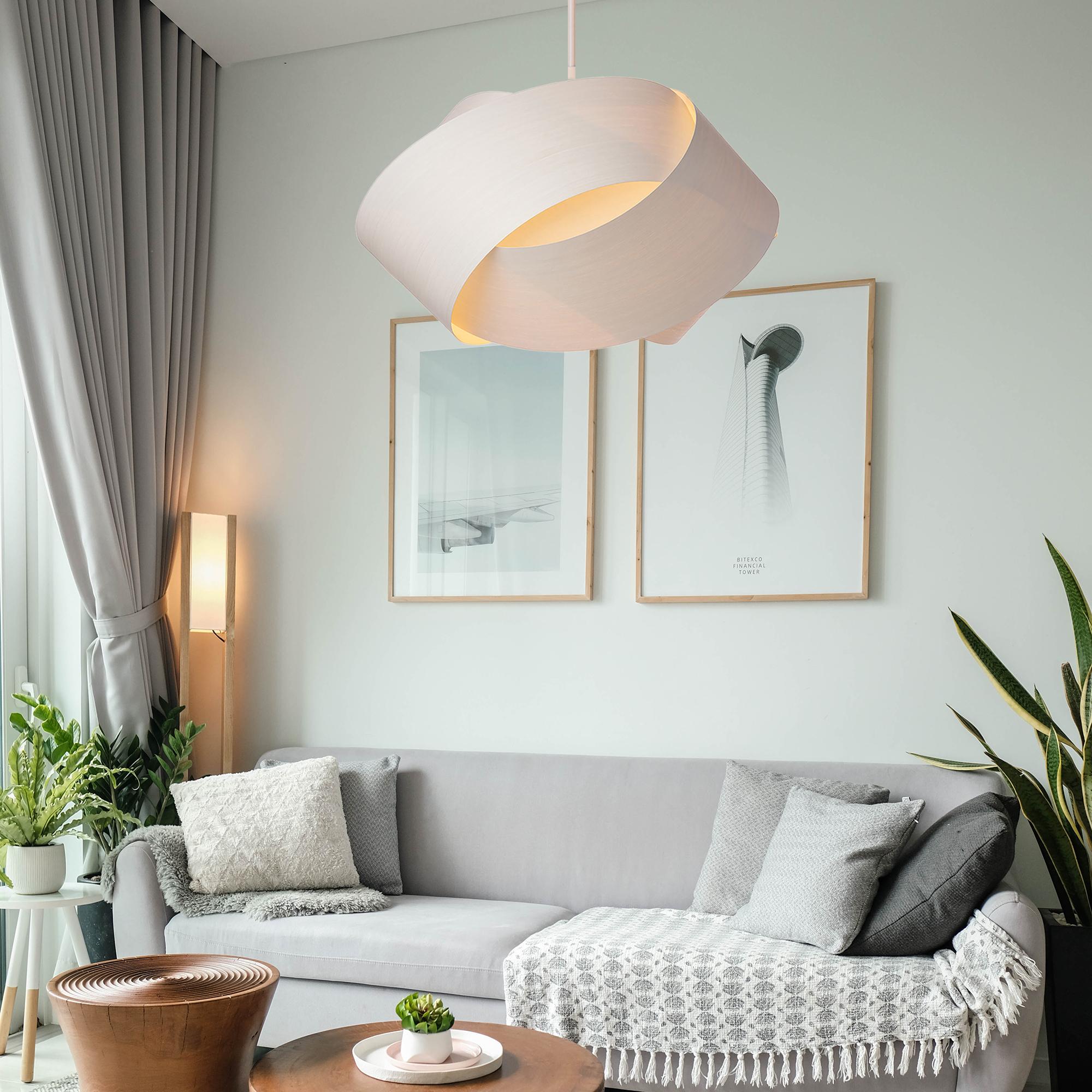 The Serene pendant light is a contemporary, Mid-Century Modern light fixture with a Scandinavian design and organic modern composition. This minimalist luxury wood veneer pendant design is the perfect way to add a touch of nature and elegance to