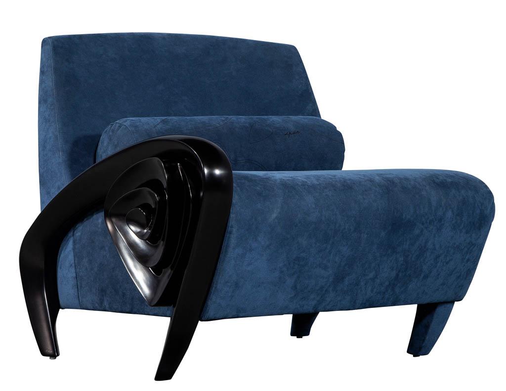 Unique Mid-Century Modern scroll arm chair. Finished in a satin black lacquer and upholstered in a royal blue ultra-suede covering. Chair is original and has designer trade mark on roll cushion.
